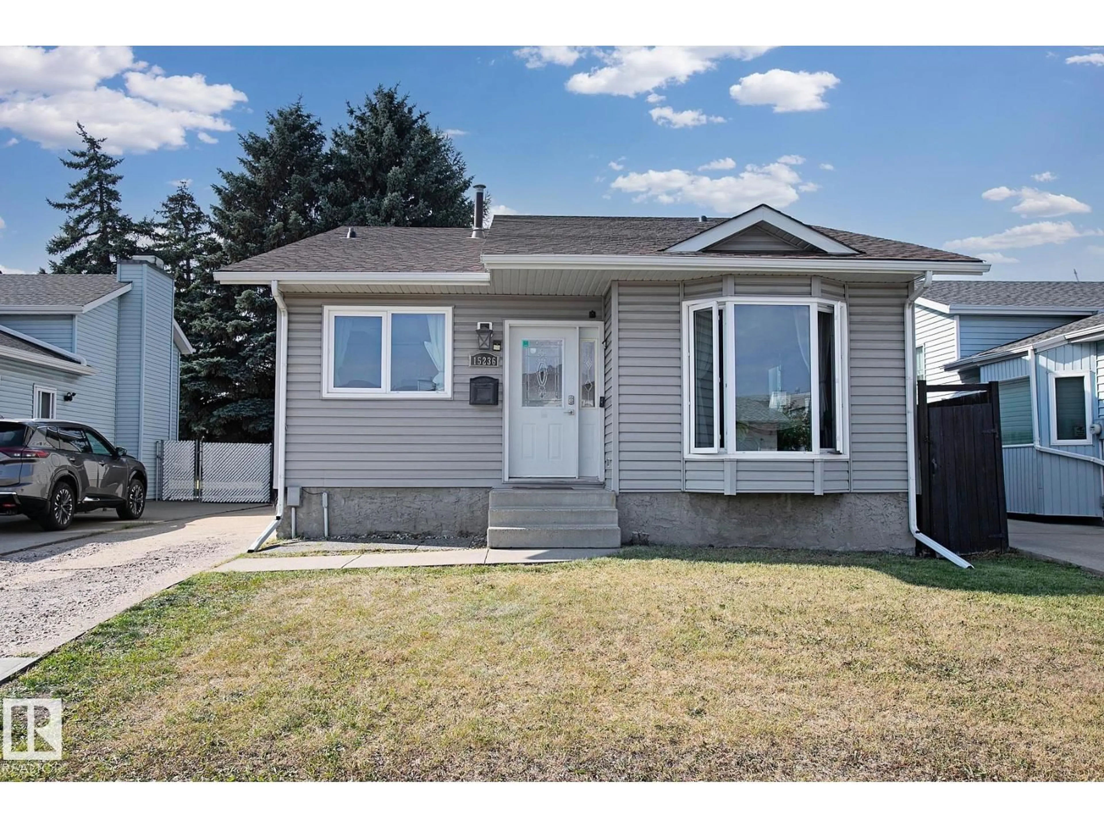 Home with vinyl exterior material, street for 15236 81 ST, Edmonton Alberta T5C3M1