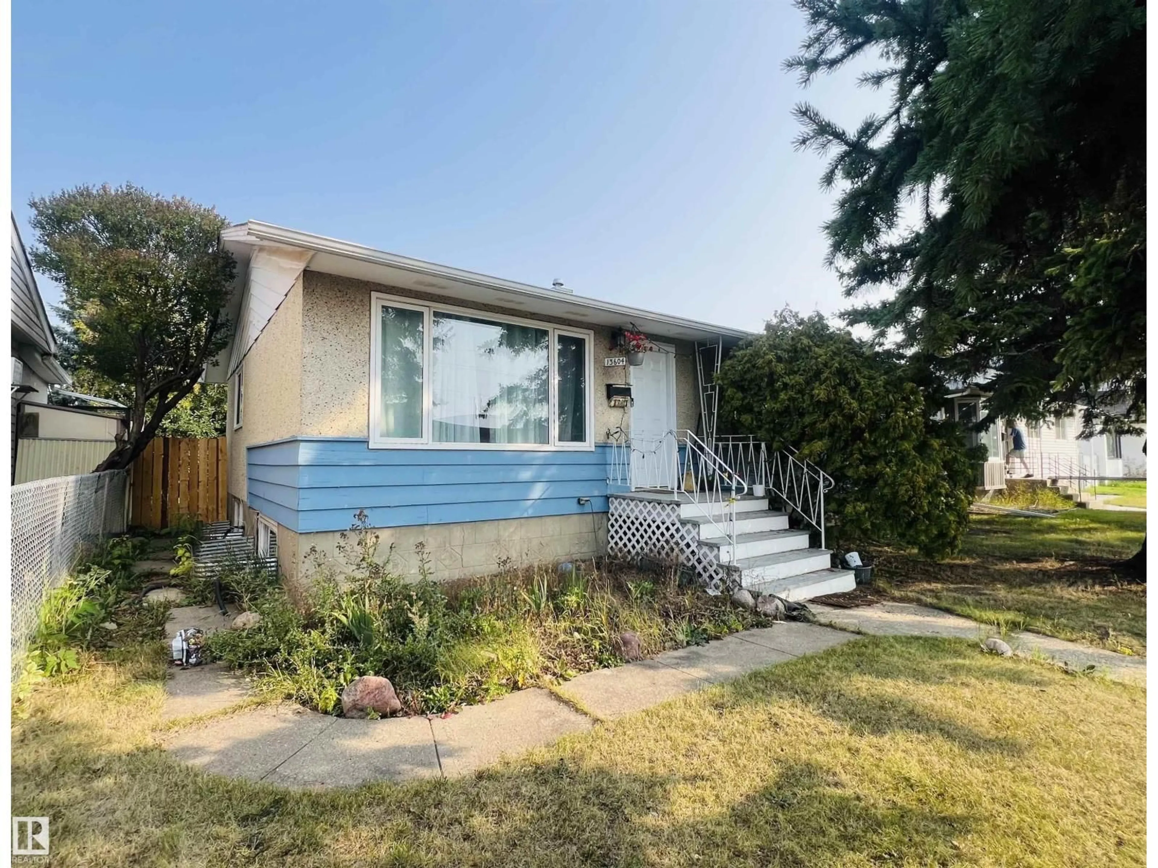Home with vinyl exterior material, street for 13604 132 AV, Edmonton Alberta T5L3R7