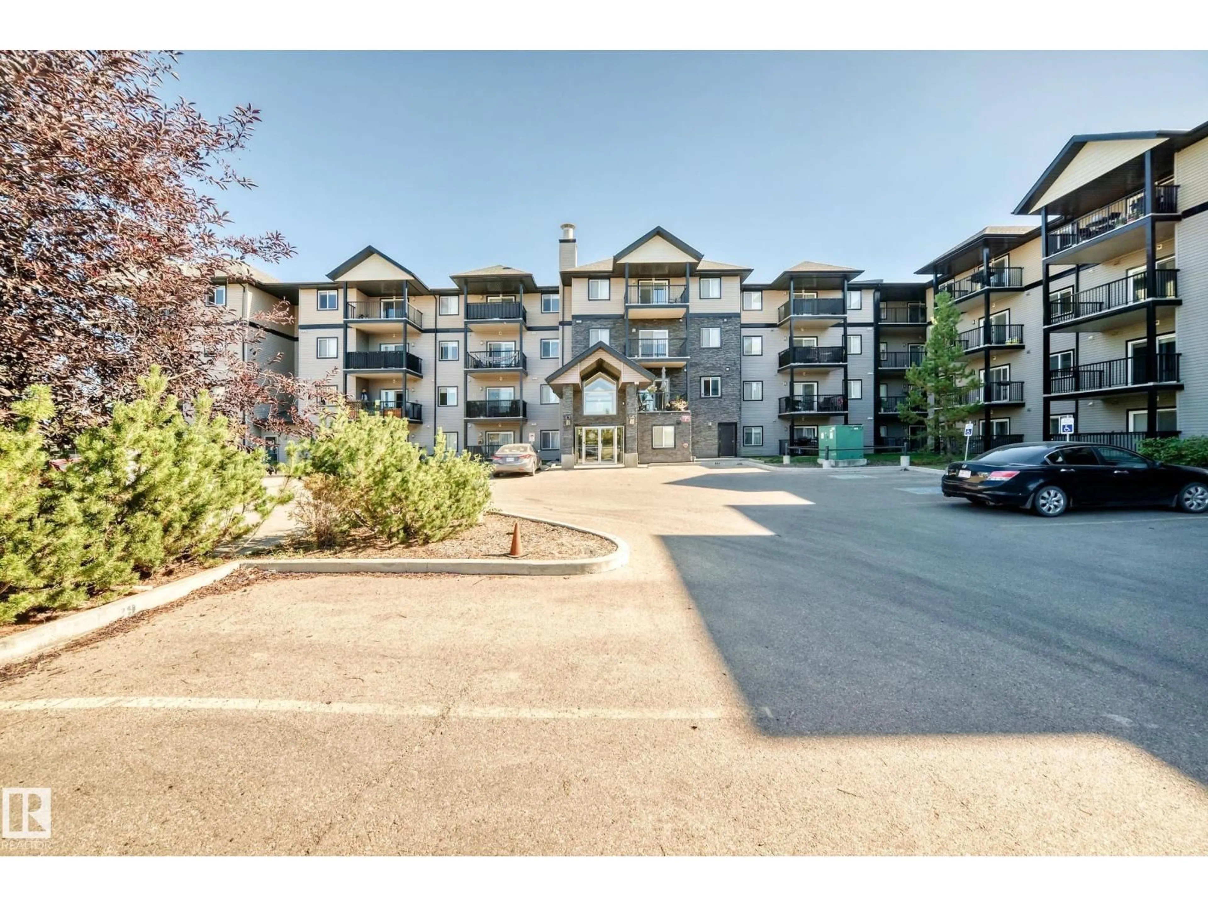 A pic from outside/outdoor area/front of a property/back of a property/a pic from drone, mountain view for 220 14808 125 ST NW, Edmonton Alberta T5X0G1