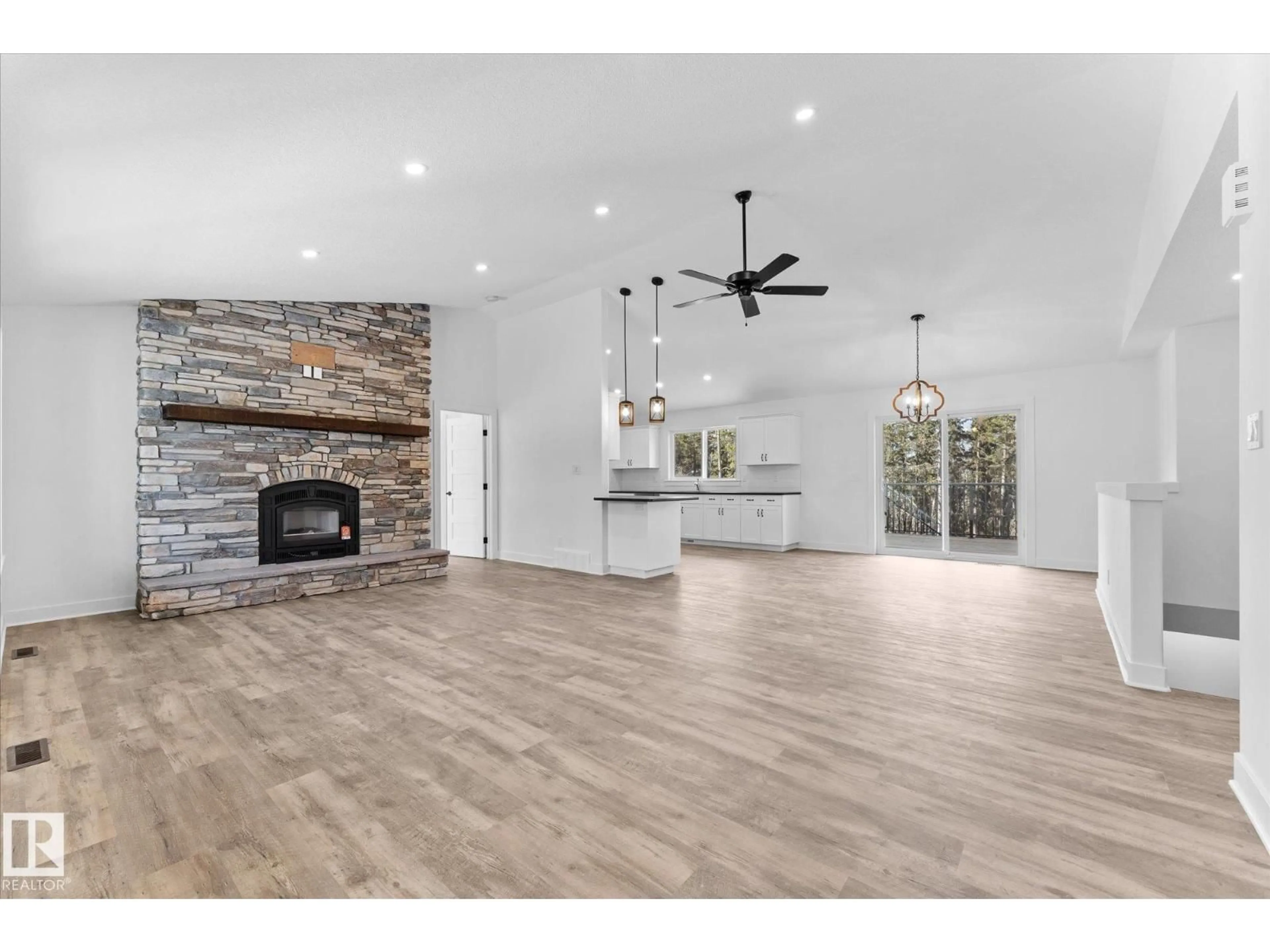 Open concept kitchen, wood/laminate floor for 13 - 311 55504 RR, Rural Lac Ste. Anne County Alberta T0E1V0