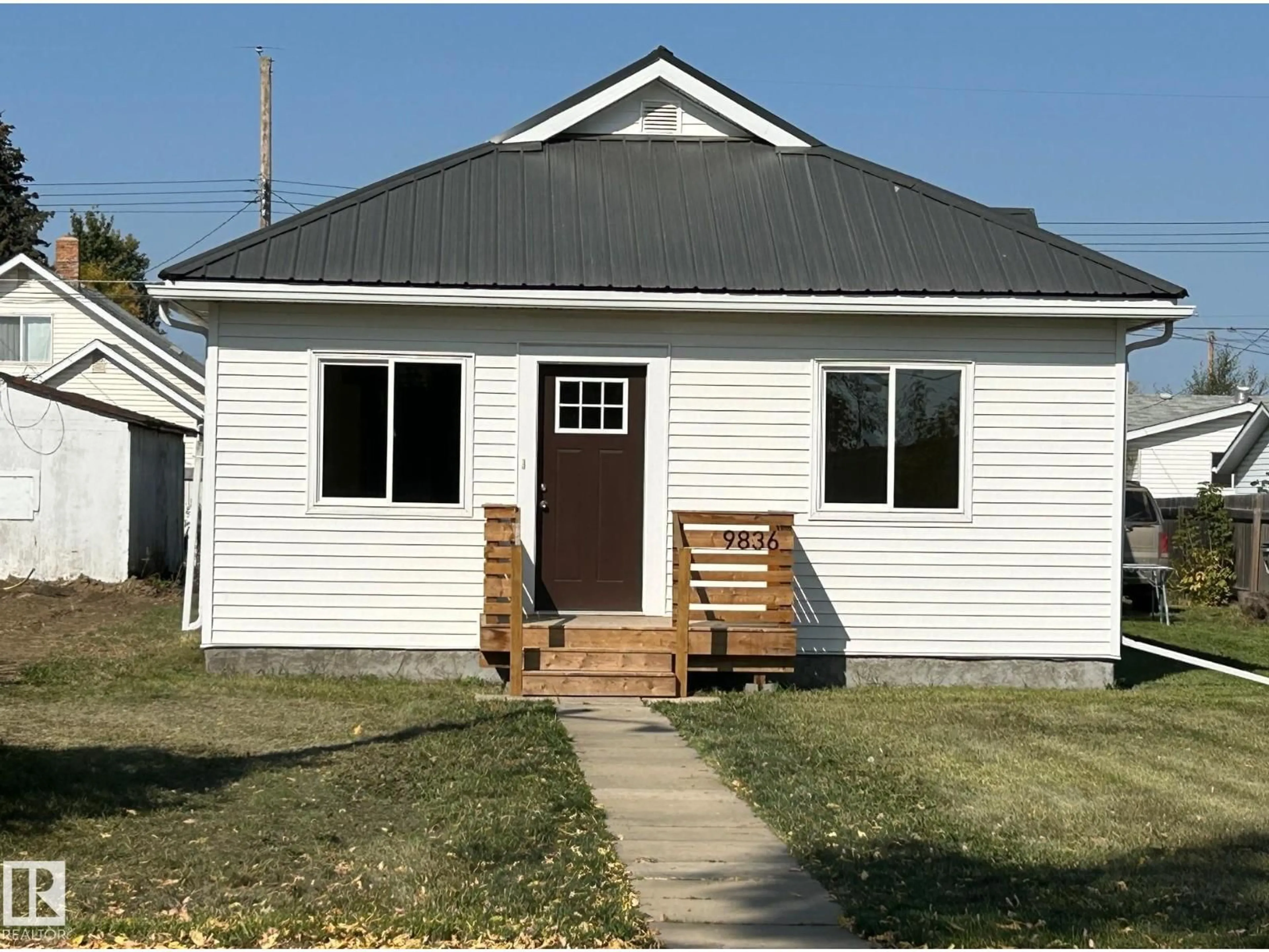 Home with vinyl exterior material, street for 9836 109 ST, Westlock Alberta T7P1P3