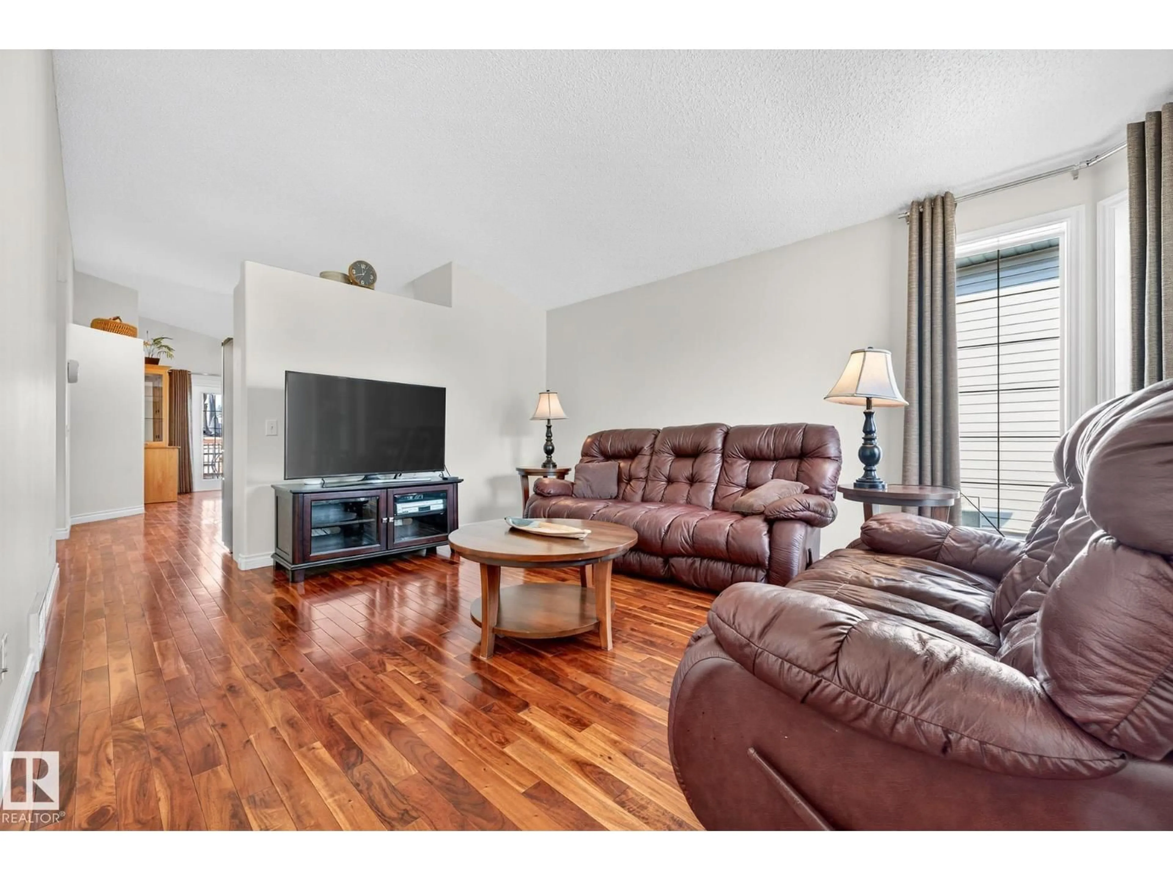 Living room with furniture, wood/laminate floor for 193 LAKEWOOD DR, Spruce Grove Alberta T7X4H6