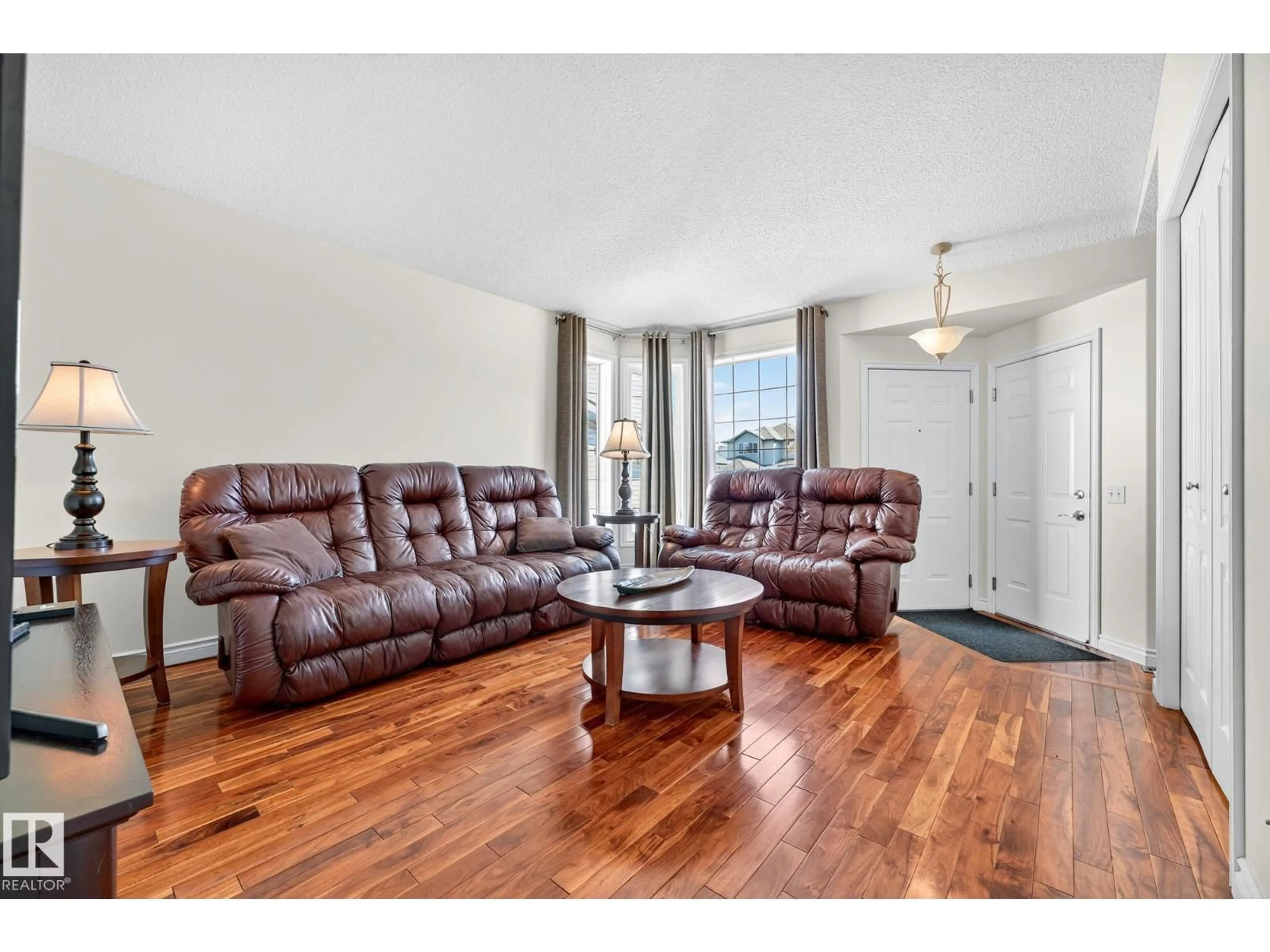 Living room with furniture, wood/laminate floor for 193 LAKEWOOD DR, Spruce Grove Alberta T7X4H6