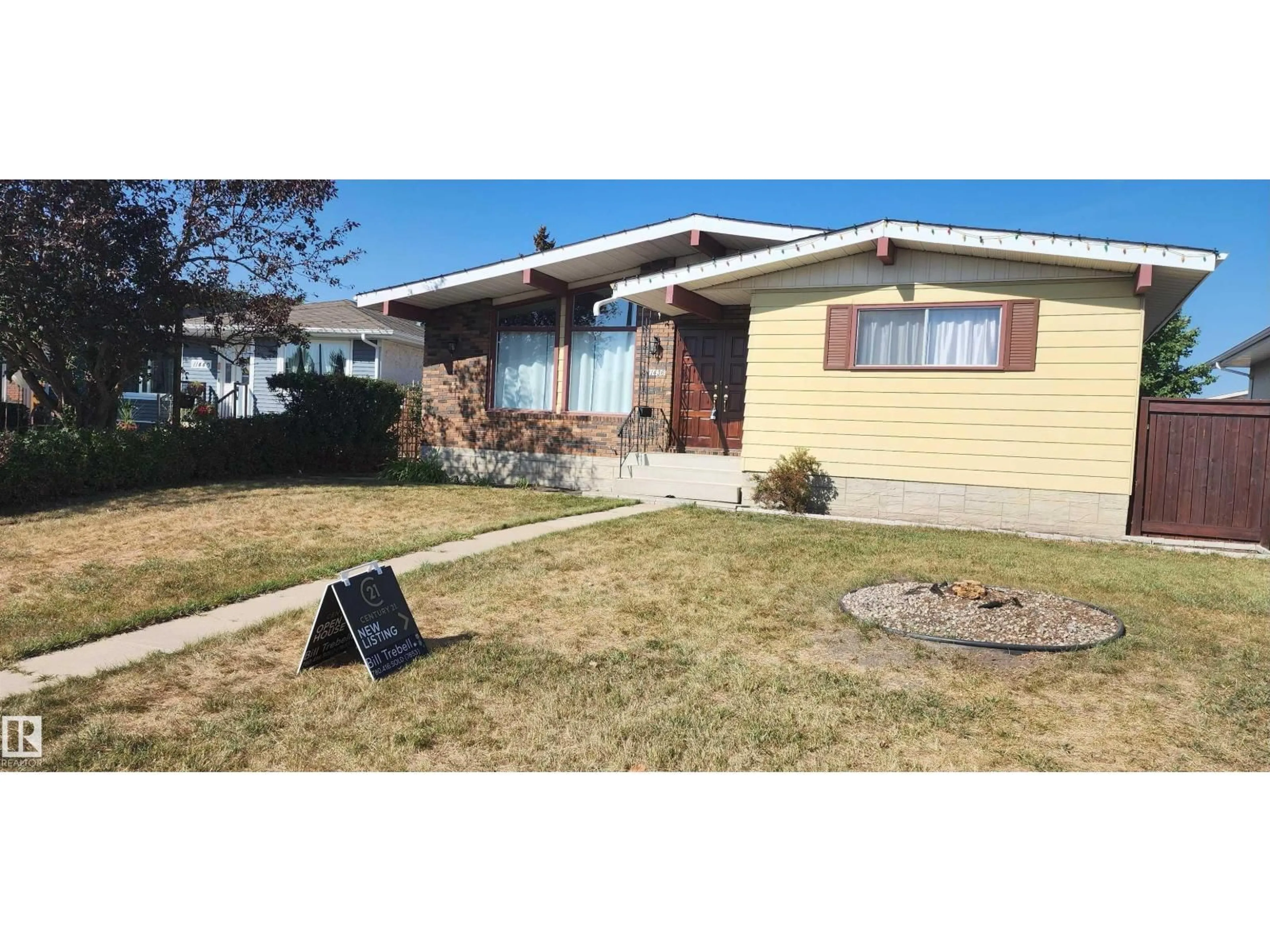 Home with vinyl exterior material, street for NW - 11436 143 AV, Edmonton Alberta T5X1L6