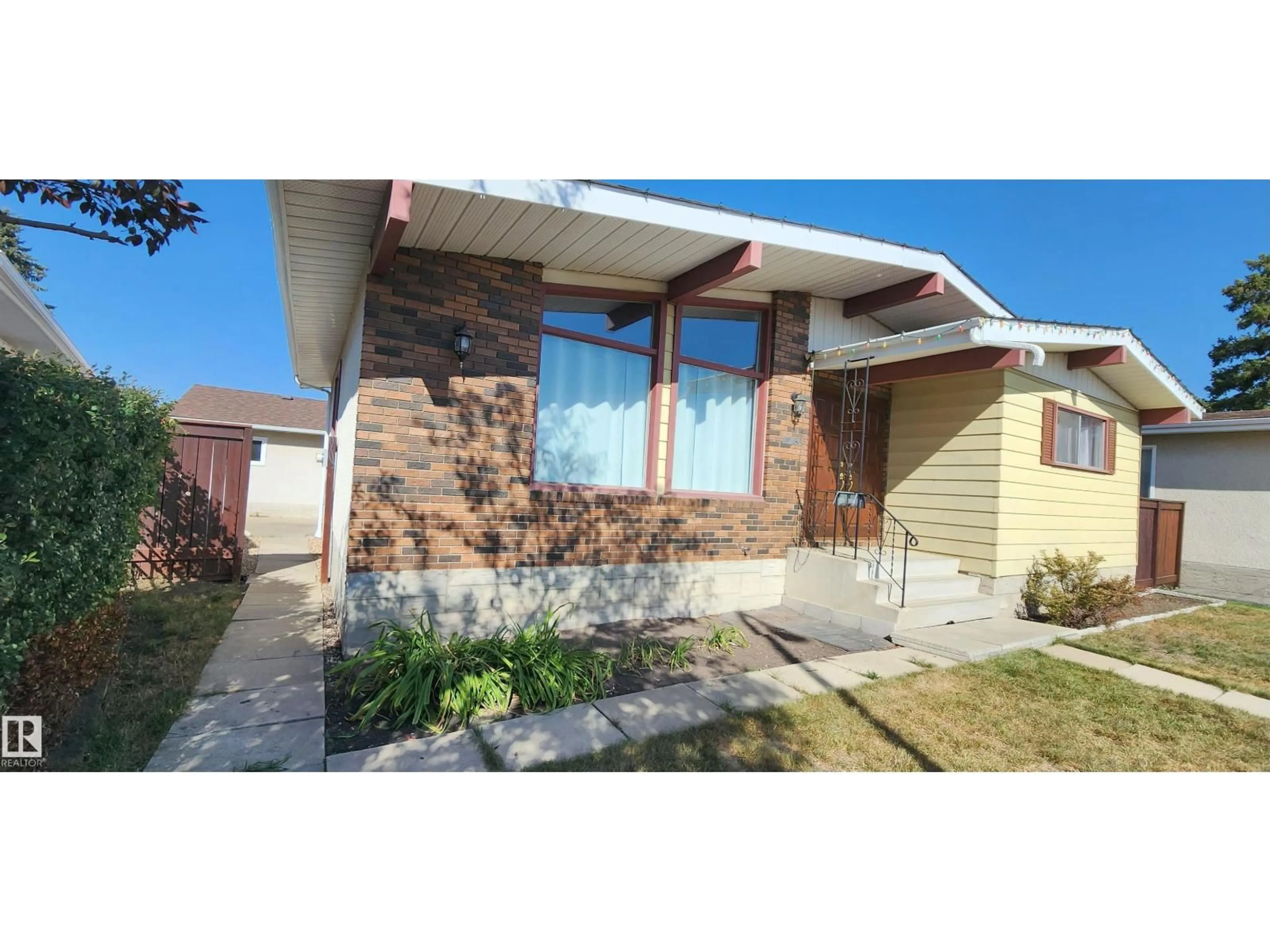 Home with brick exterior material, street for NW - 11436 143 AV, Edmonton Alberta T5X1L6