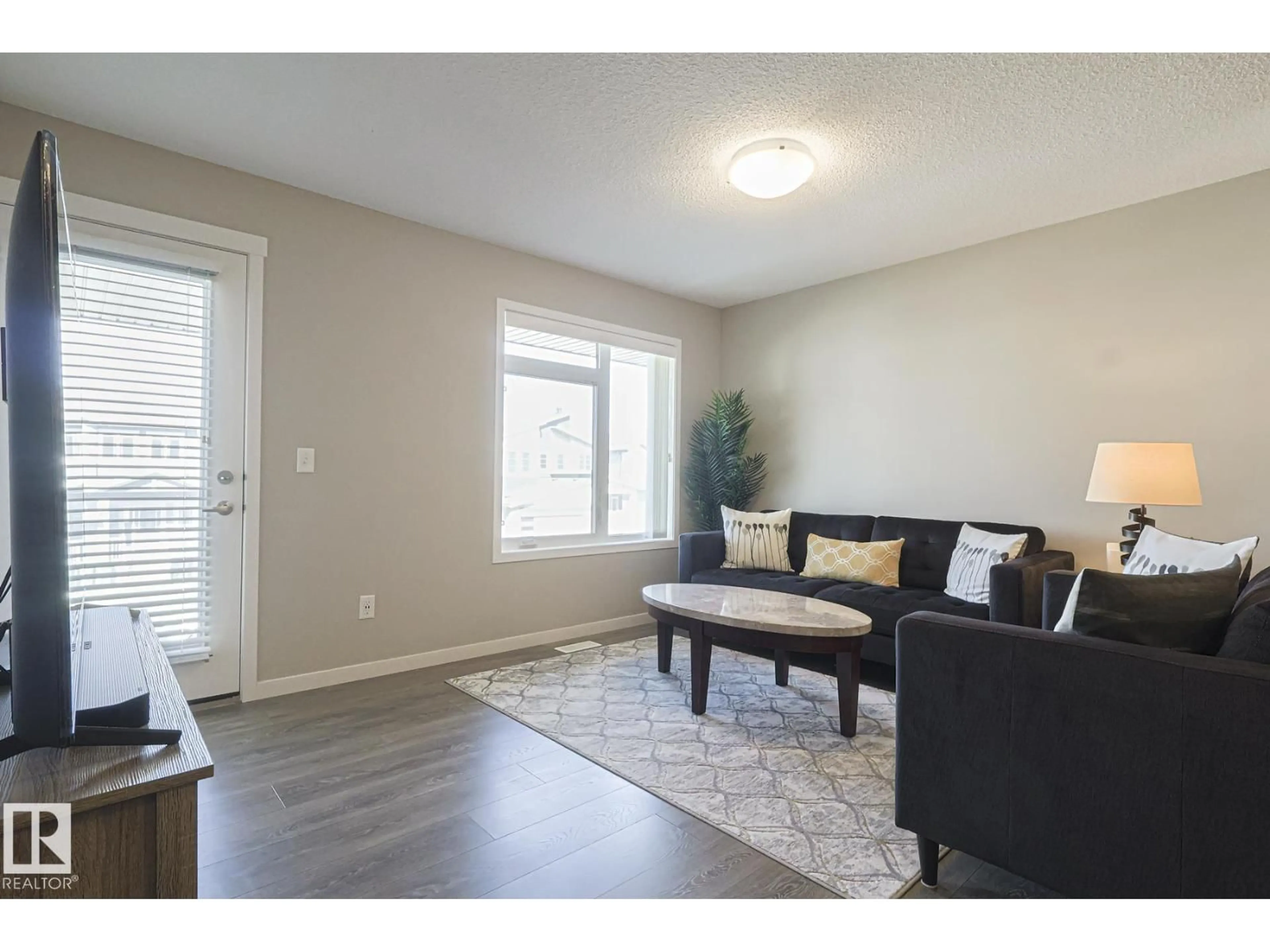 Living room with furniture, unknown for 17251 9 AV, Edmonton Alberta T6W3V4
