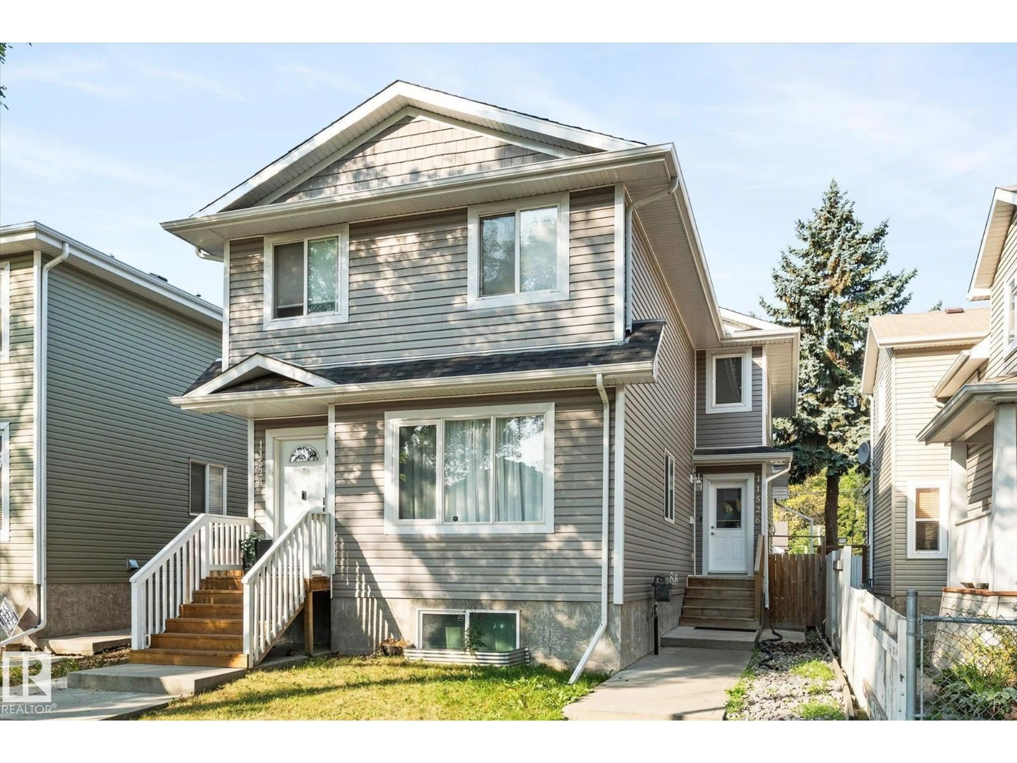Home with vinyl exterior material, street for 11526 92 ST, Edmonton Alberta T5G0Z7