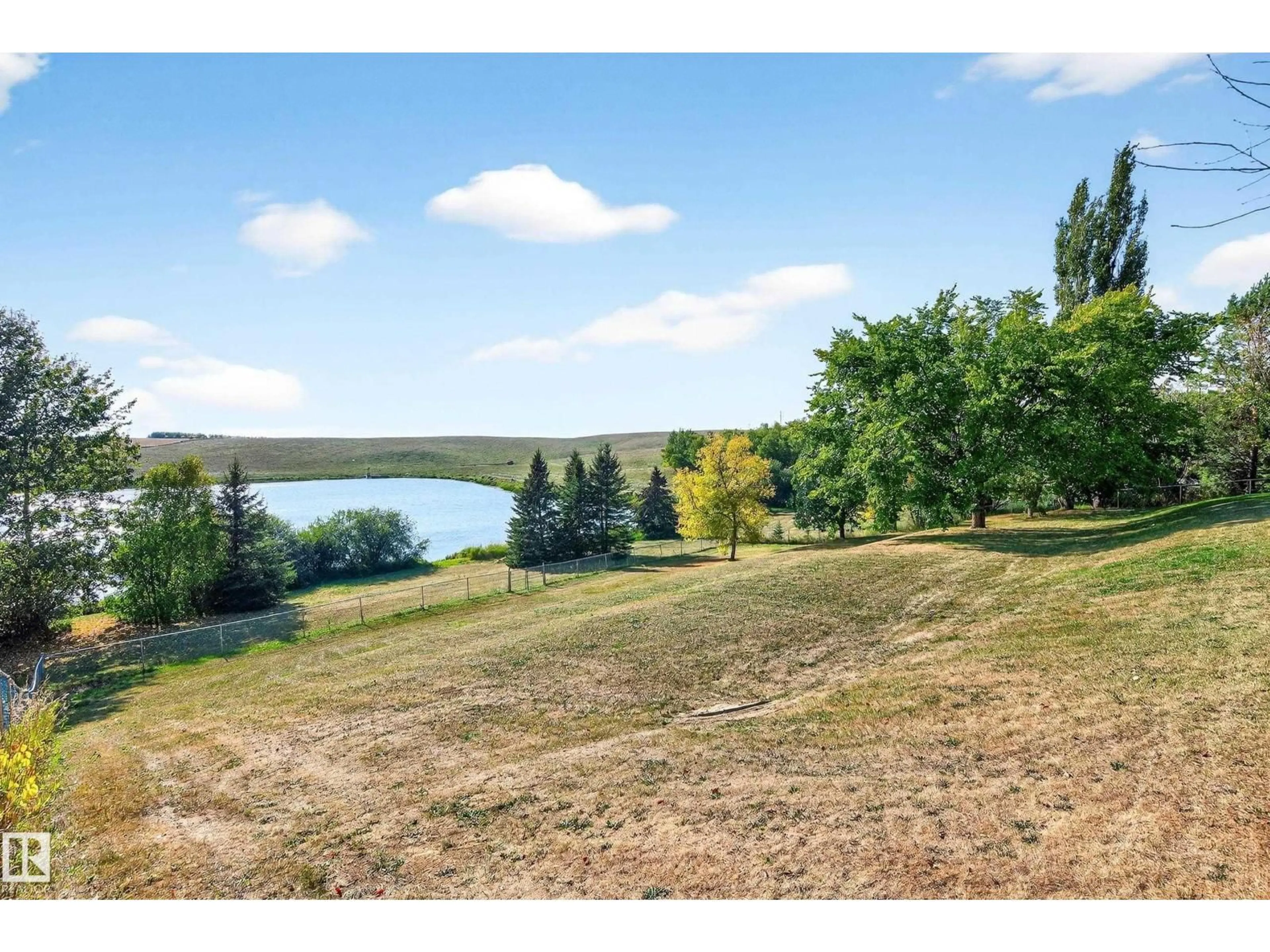 A pic from outside/outdoor area/front of a property/back of a property/a pic from drone, water/lake/river/ocean view for #6 - 2022 PARKLAND DR, Rural Parkland County Alberta T7Y2S1