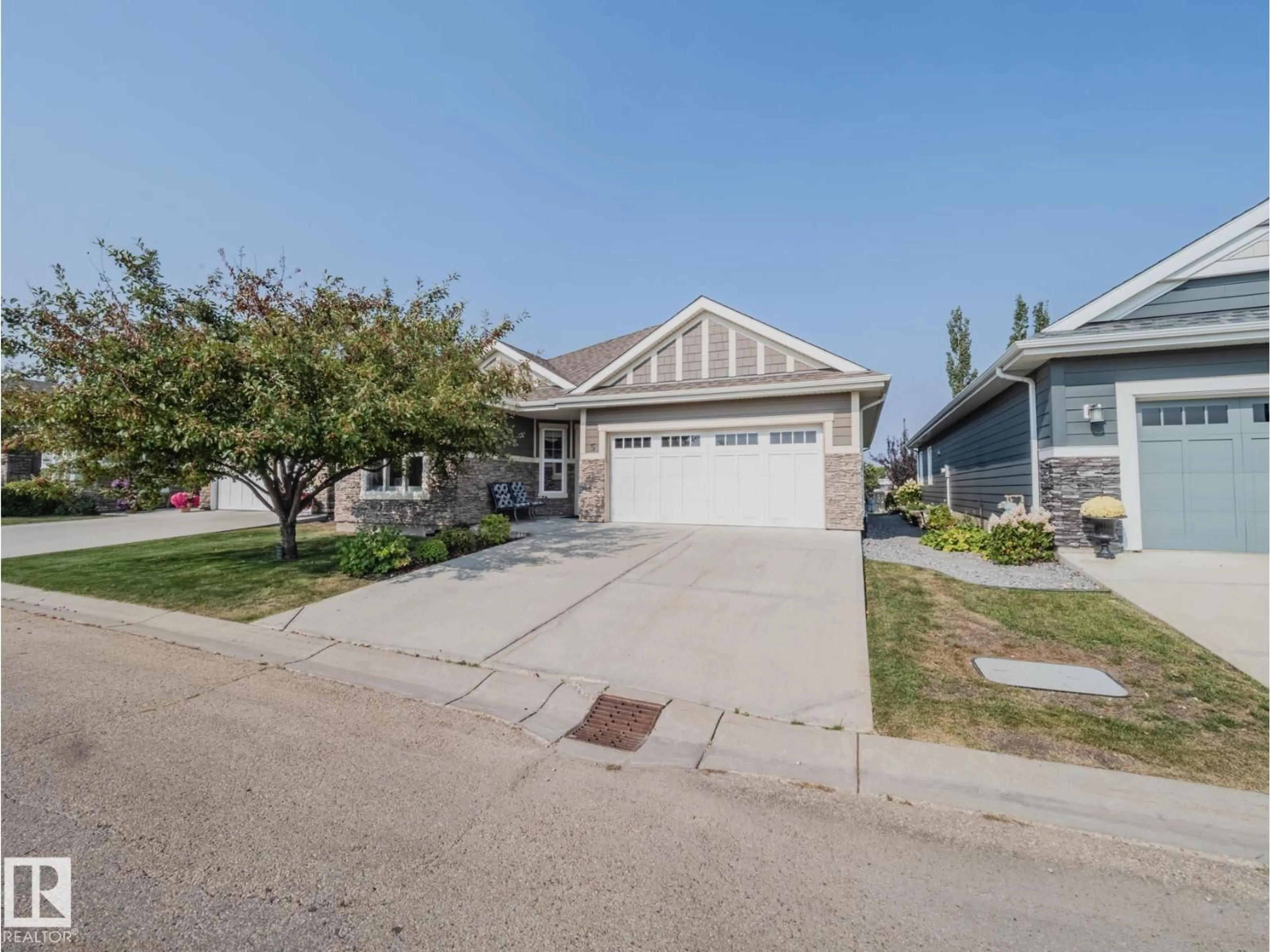Home with vinyl exterior material, street for 5 - 18343 LESSARD RD, Edmonton Alberta T6M0A2