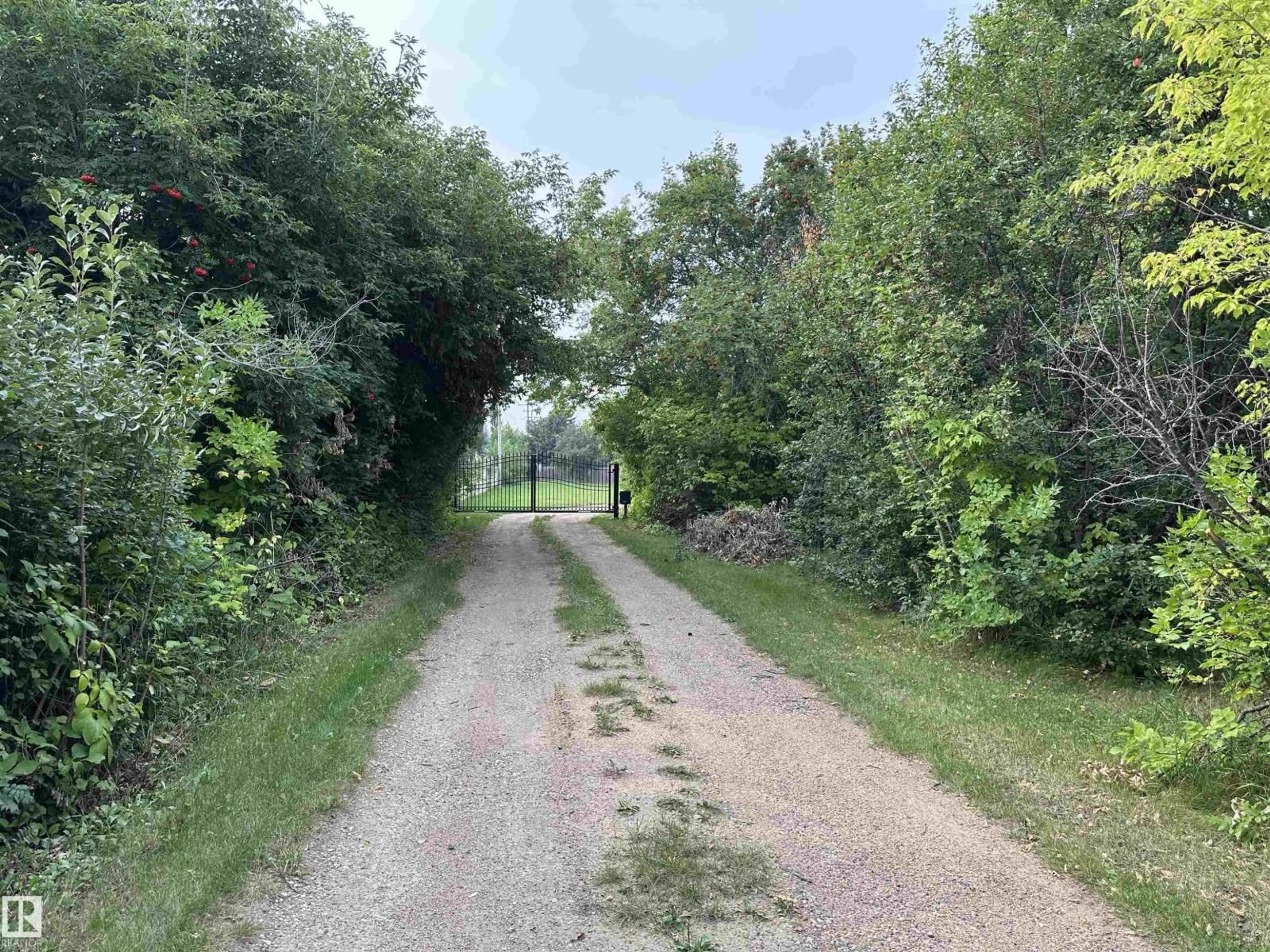 A pic from outside/outdoor area/front of a property/back of a property/a pic from drone, forest/trees view for 5203 51A AV, Bon Accord Alberta T0A0K0