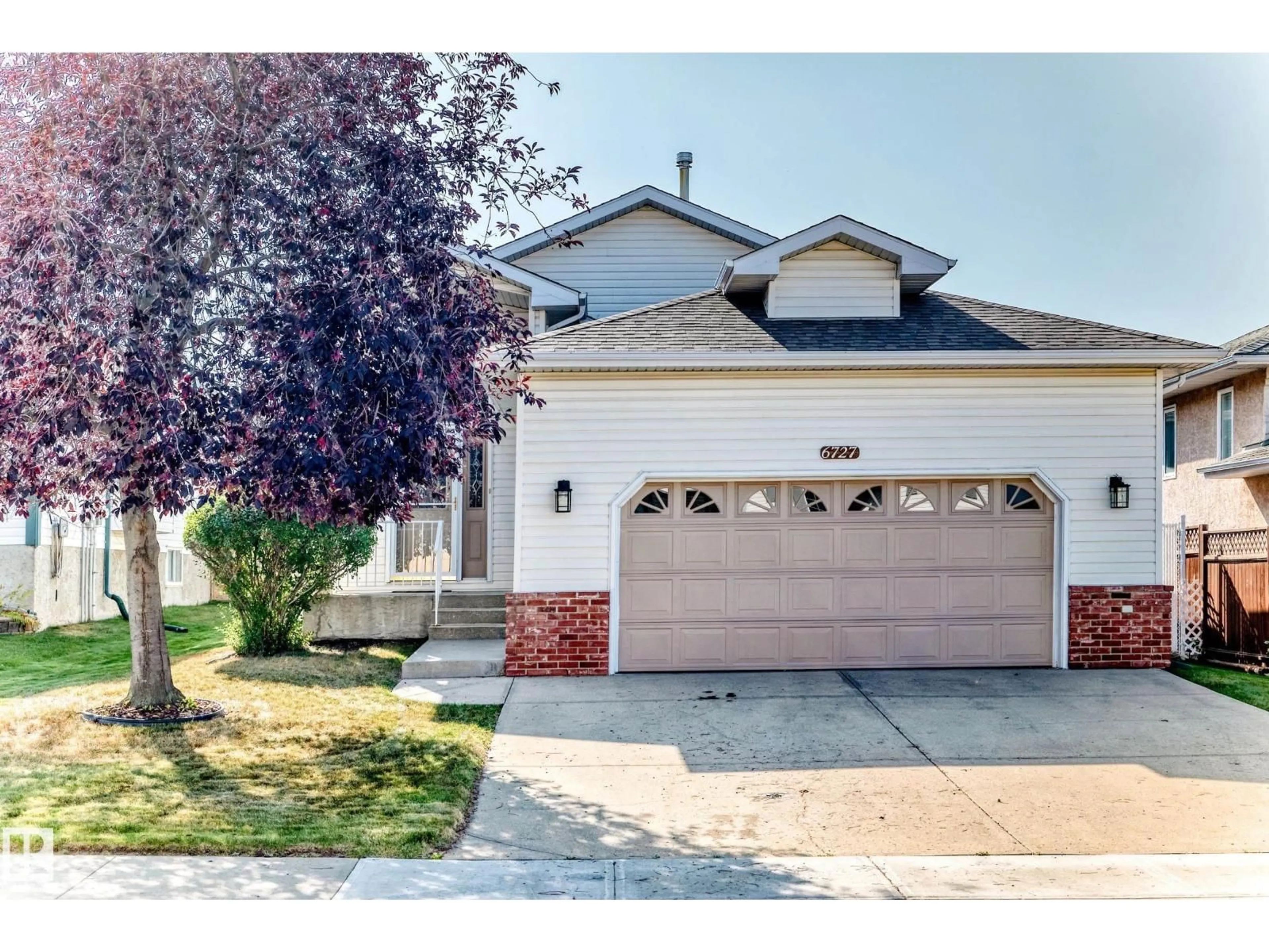 Home with vinyl exterior material, street for NW - 6727 162 AV, Edmonton Alberta T5Z3C5