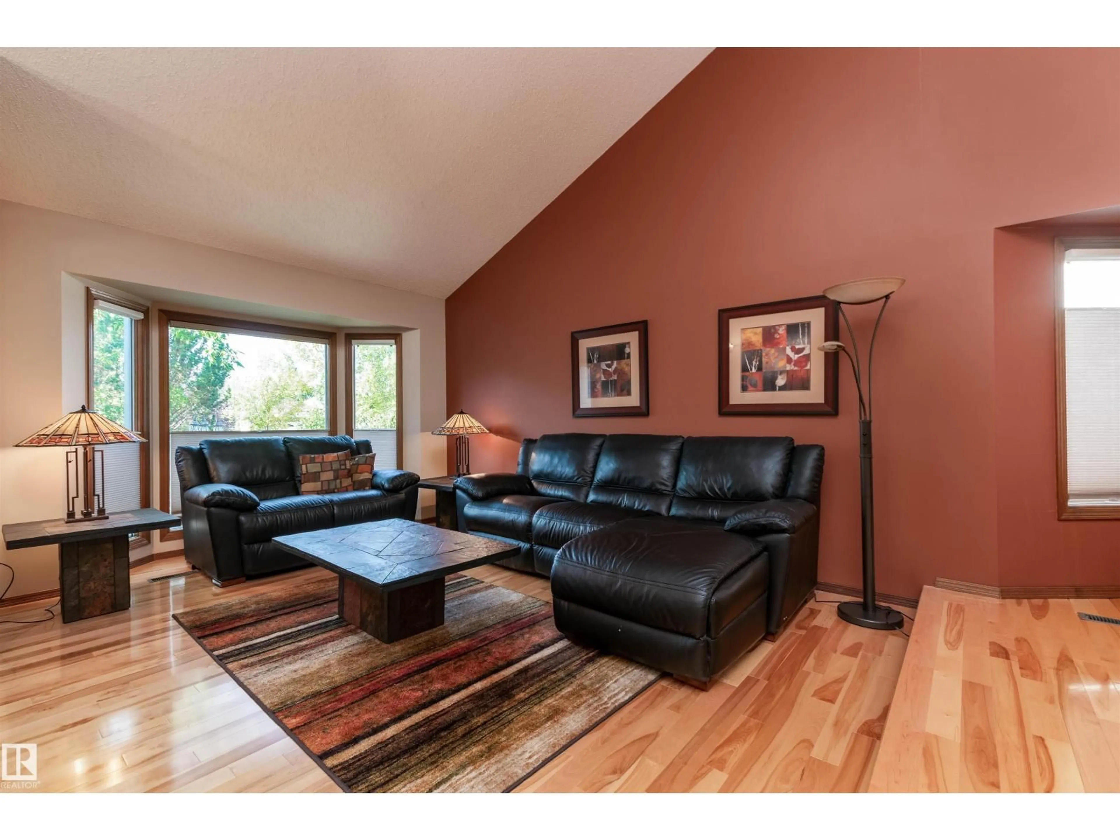 Living room with furniture, wood/laminate floor for 695 MEADOWVIEW DR, Sherwood Park Alberta T8H1G2