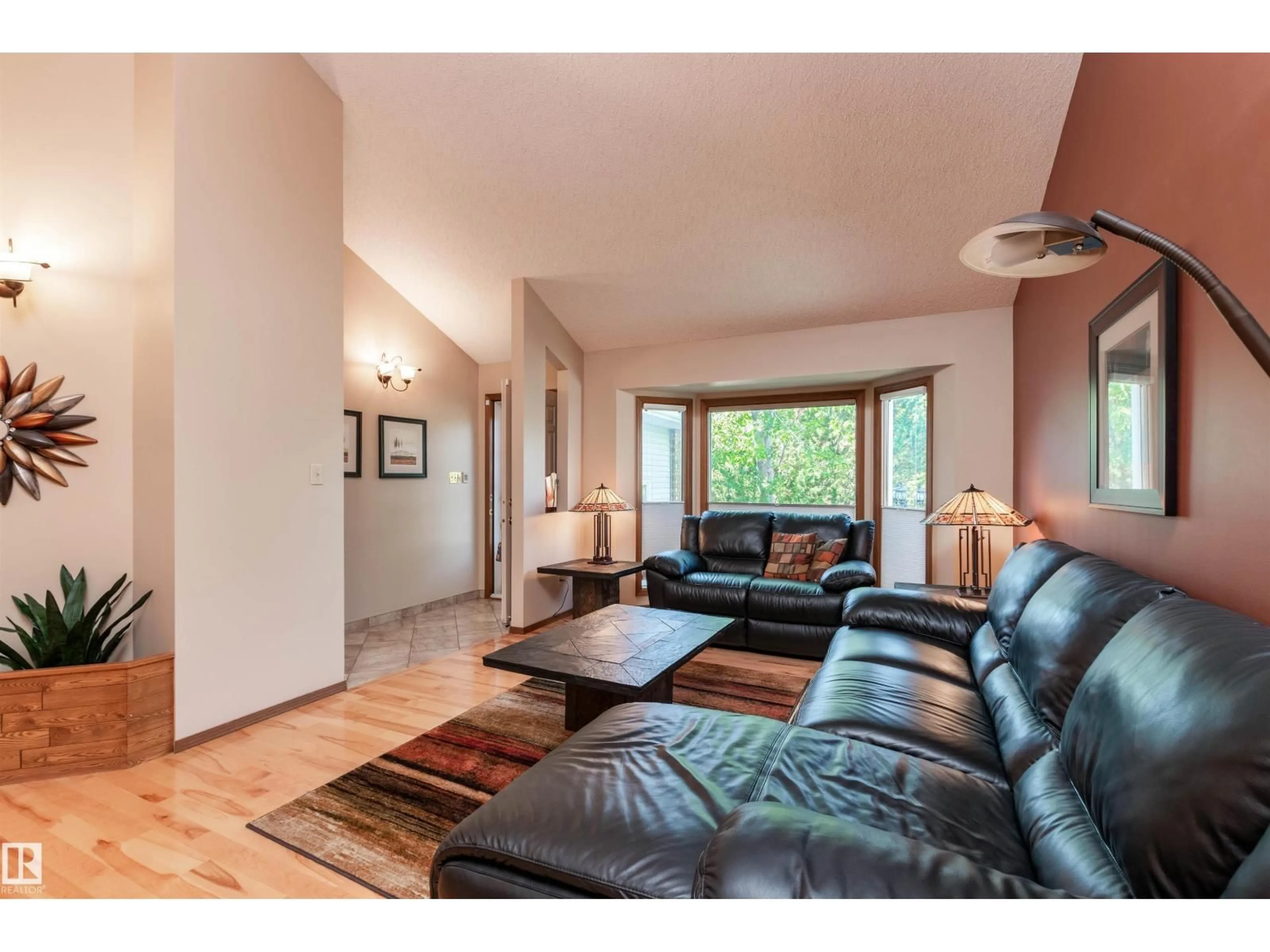 Living room with furniture, wood/laminate floor for 695 MEADOWVIEW DR, Sherwood Park Alberta T8H1G2