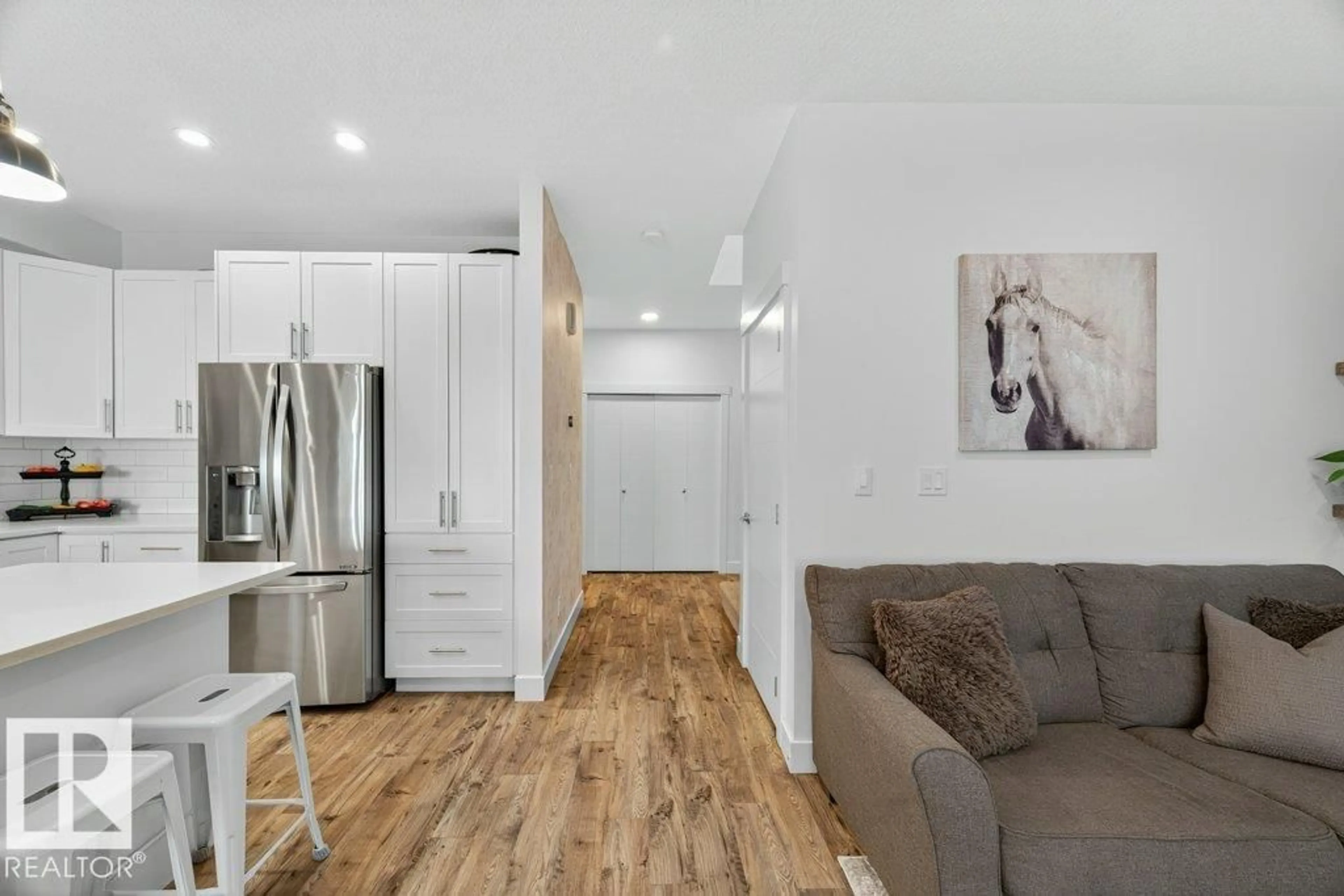 Open concept kitchen, wood/laminate floor for 424 GENESIS CO, Stony Plain Alberta T7Z0M2
