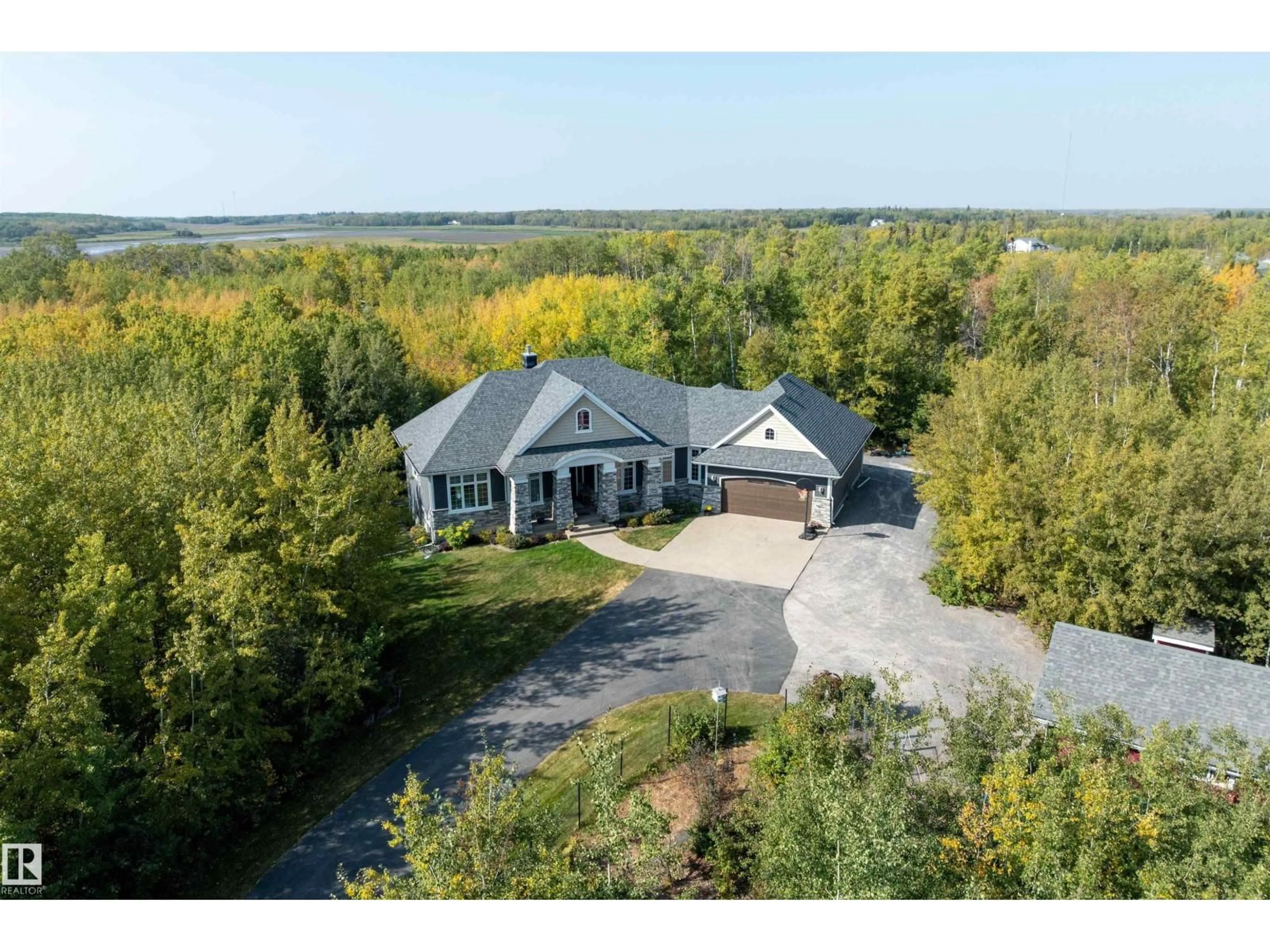 A pic from outside/outdoor area/front of a property/back of a property/a pic from drone, water/lake/river/ocean view for 50520 RR 225, Rural Leduc County Alberta T0B3M1