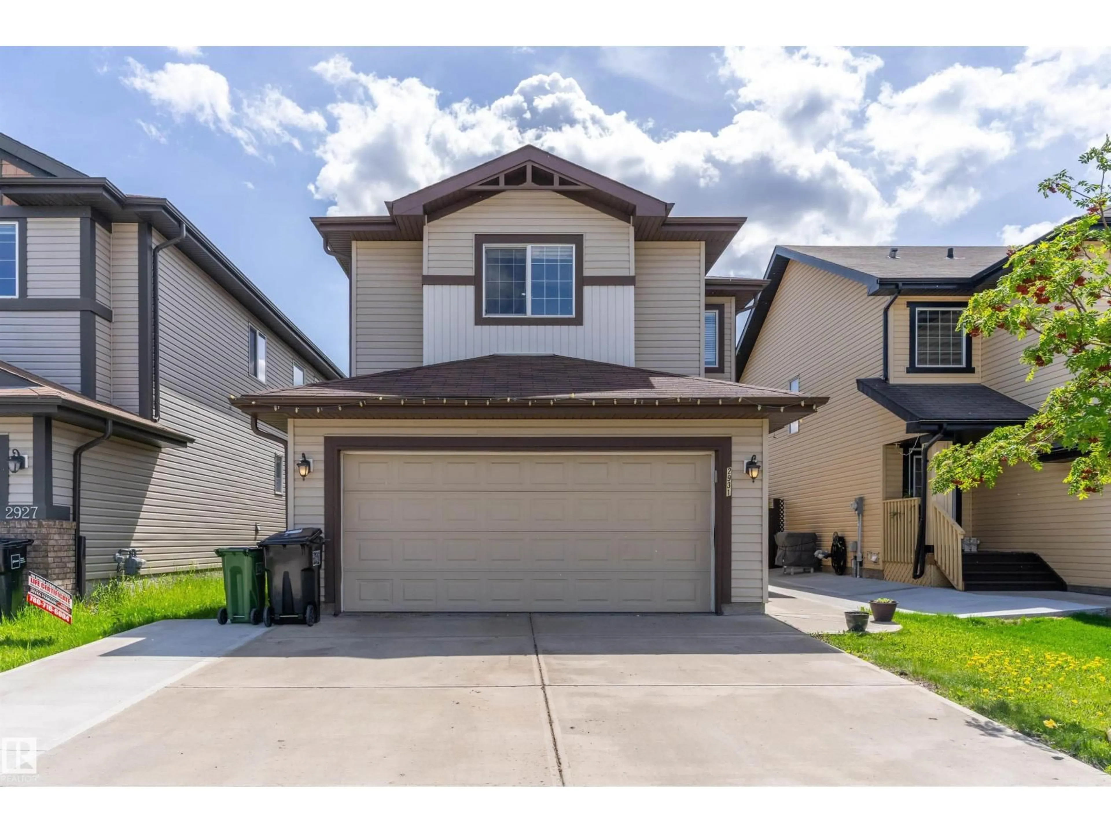 Home with vinyl exterior material, street for NW - 2931 26 AVE, Edmonton Alberta T6T0H6