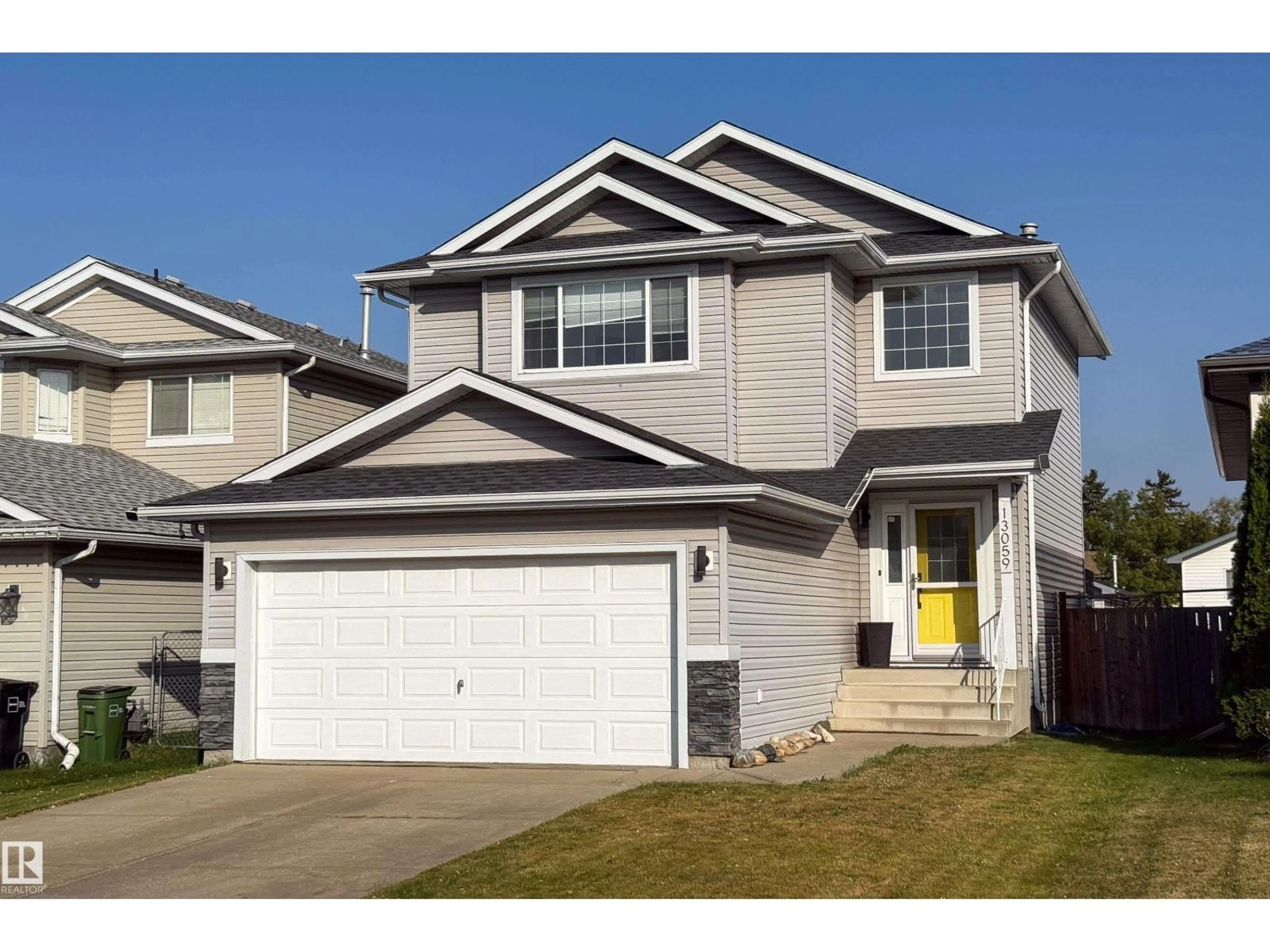 Home with vinyl exterior material, street for NW - 13059 35 ST, Edmonton Alberta T5A5C8