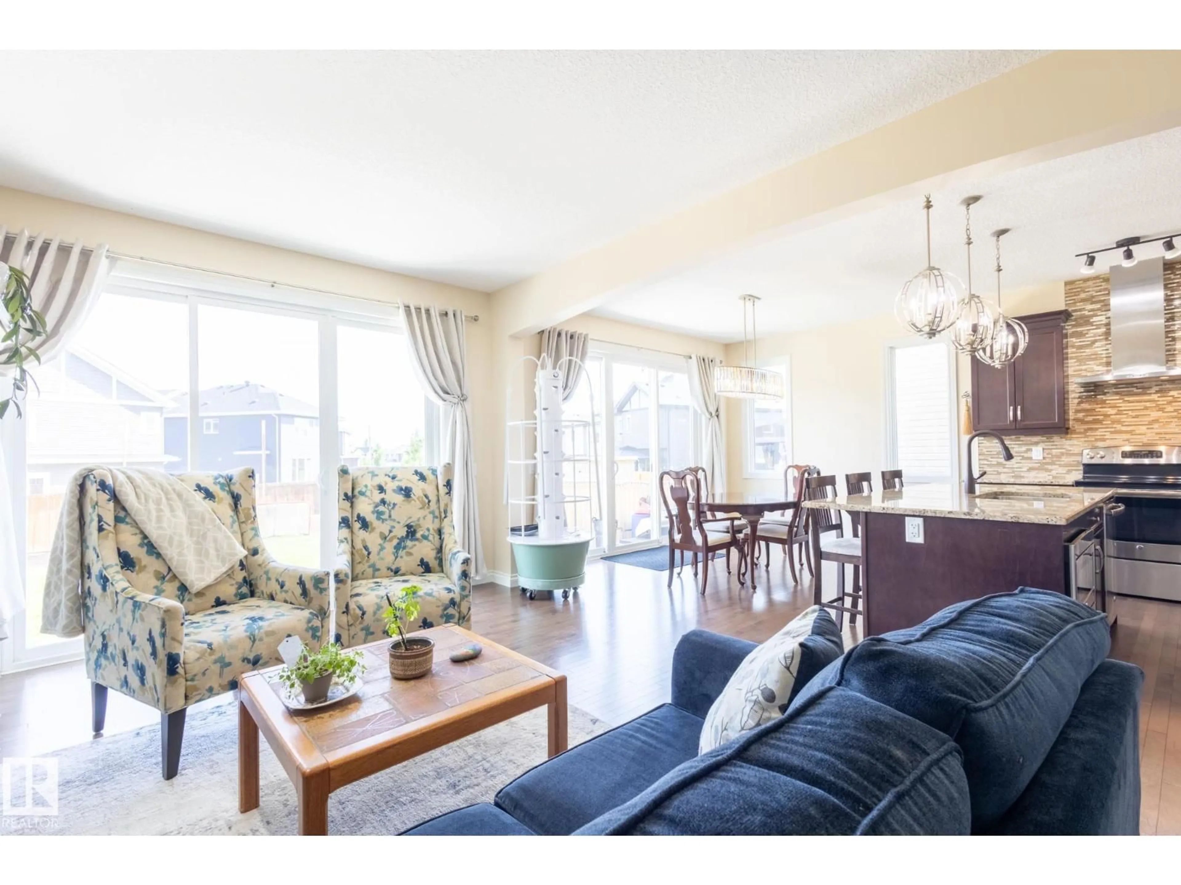 Living room with furniture, wood/laminate floor for NW - 20820 130 AV, Edmonton Alberta T5S0L4