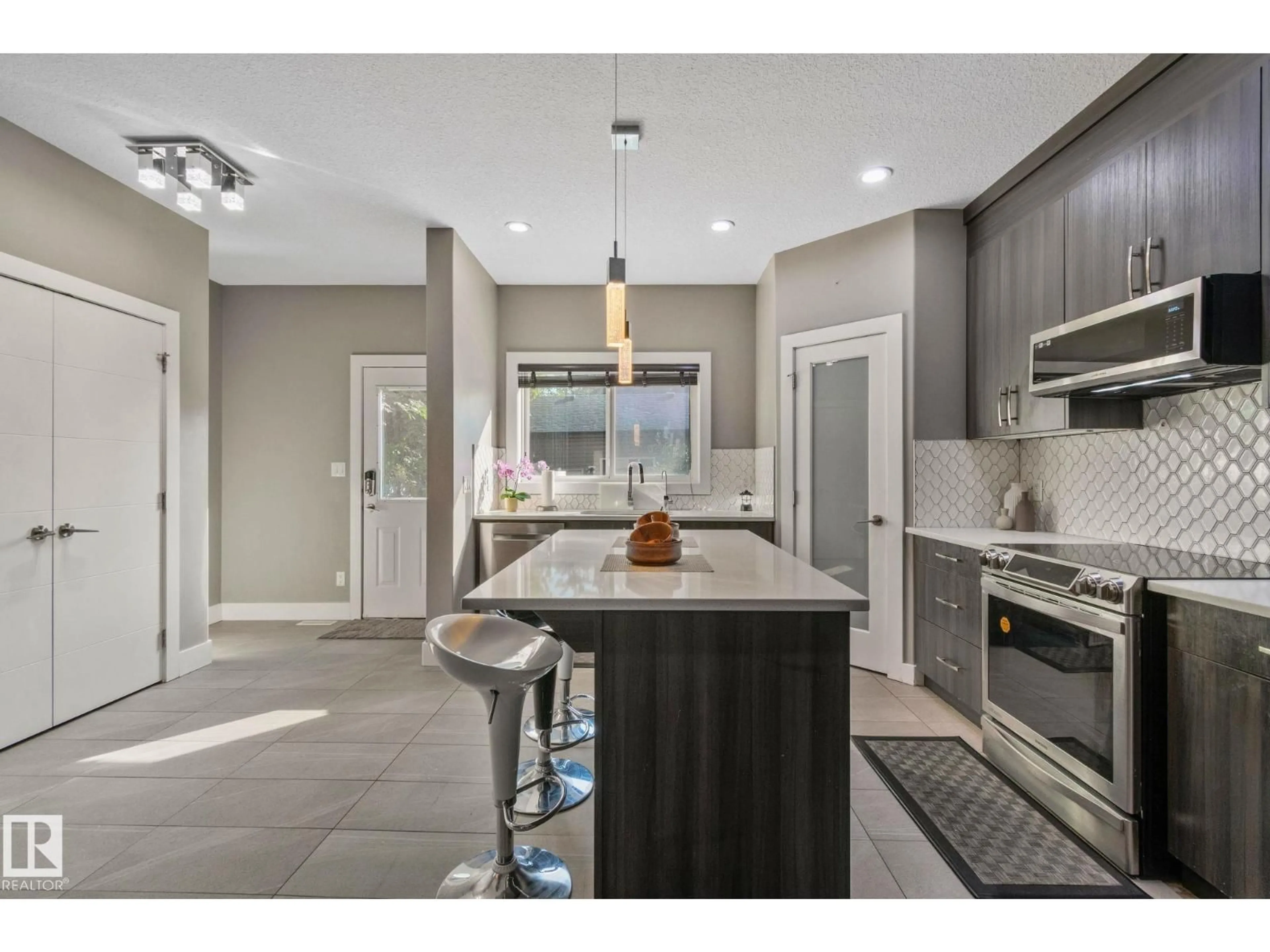 Open concept kitchen, ceramic/tile floor for 8307 81 AV, Edmonton Alberta T6C0W1