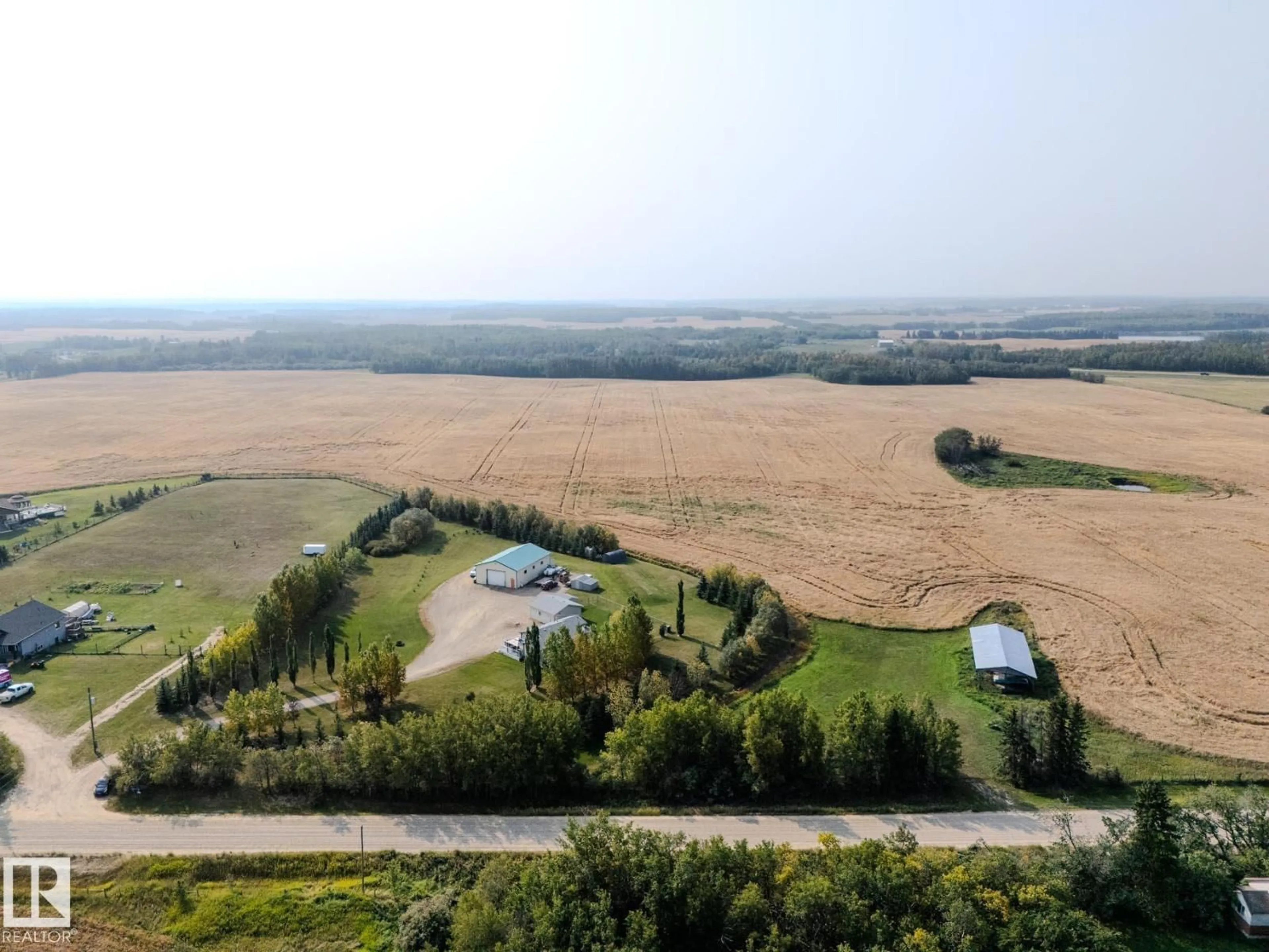 A pic from outside/outdoor area/front of a property/back of a property/a pic from drone, unknown for B - 23021 TWP ROAD 502, Rural Leduc County Alberta T0B3M1