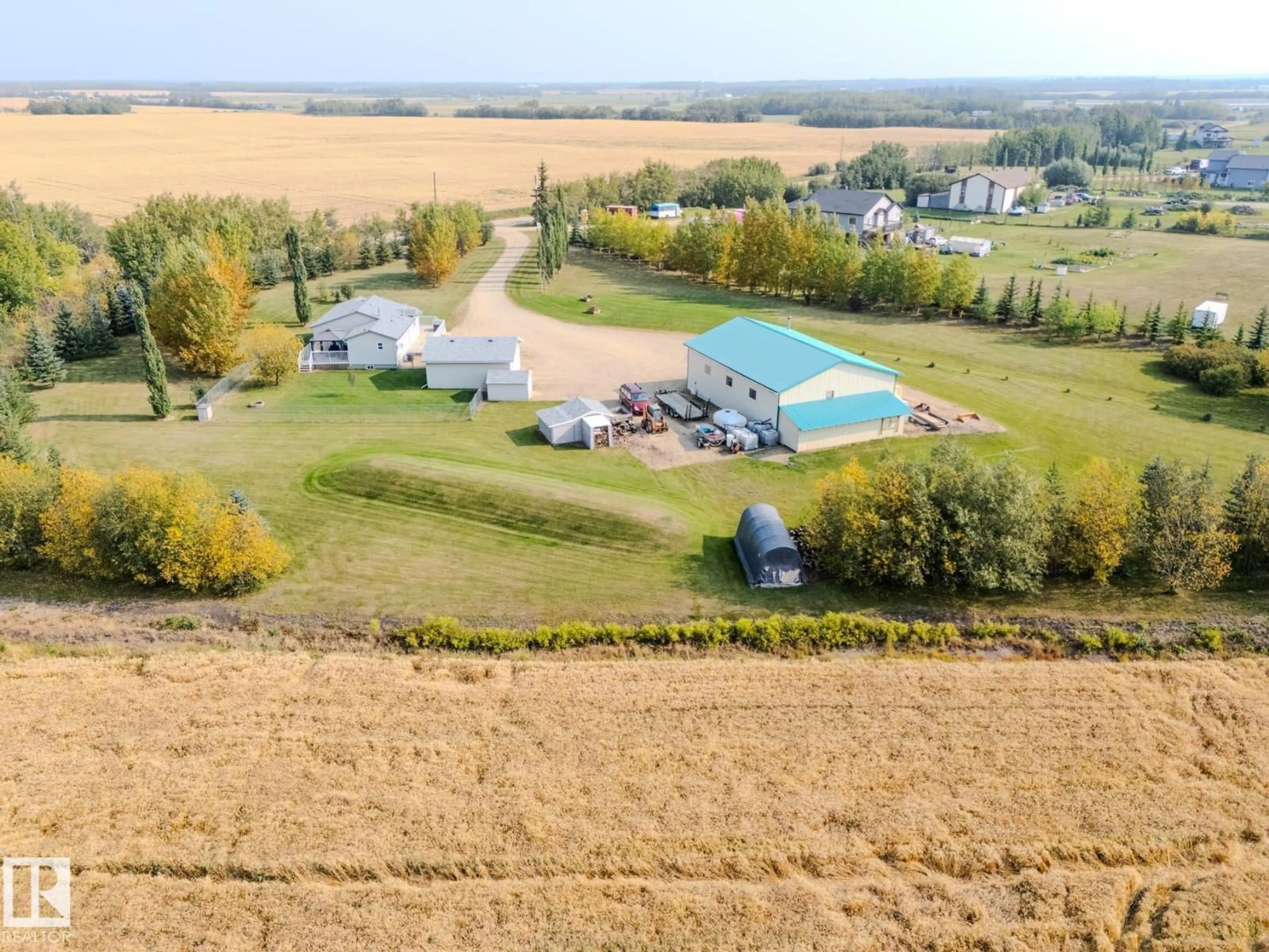 A pic from outside/outdoor area/front of a property/back of a property/a pic from drone, water/lake/river/ocean view for B - 23021 TWP ROAD 502, Rural Leduc County Alberta T0B3M1