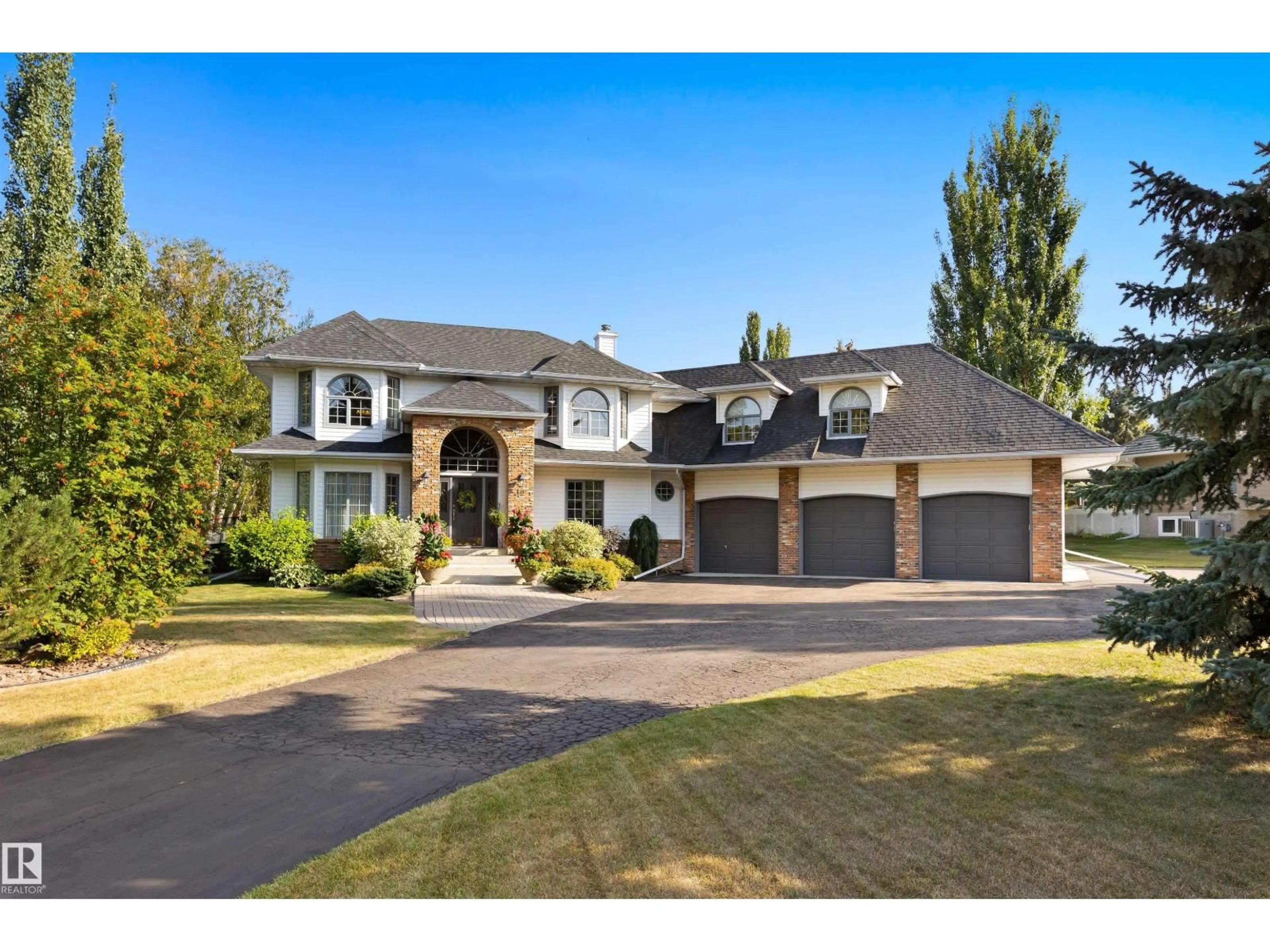 Home with brick exterior material, street for 12 25112 TWP ROAD 542A, Rural Sturgeon County Alberta T8T0B2