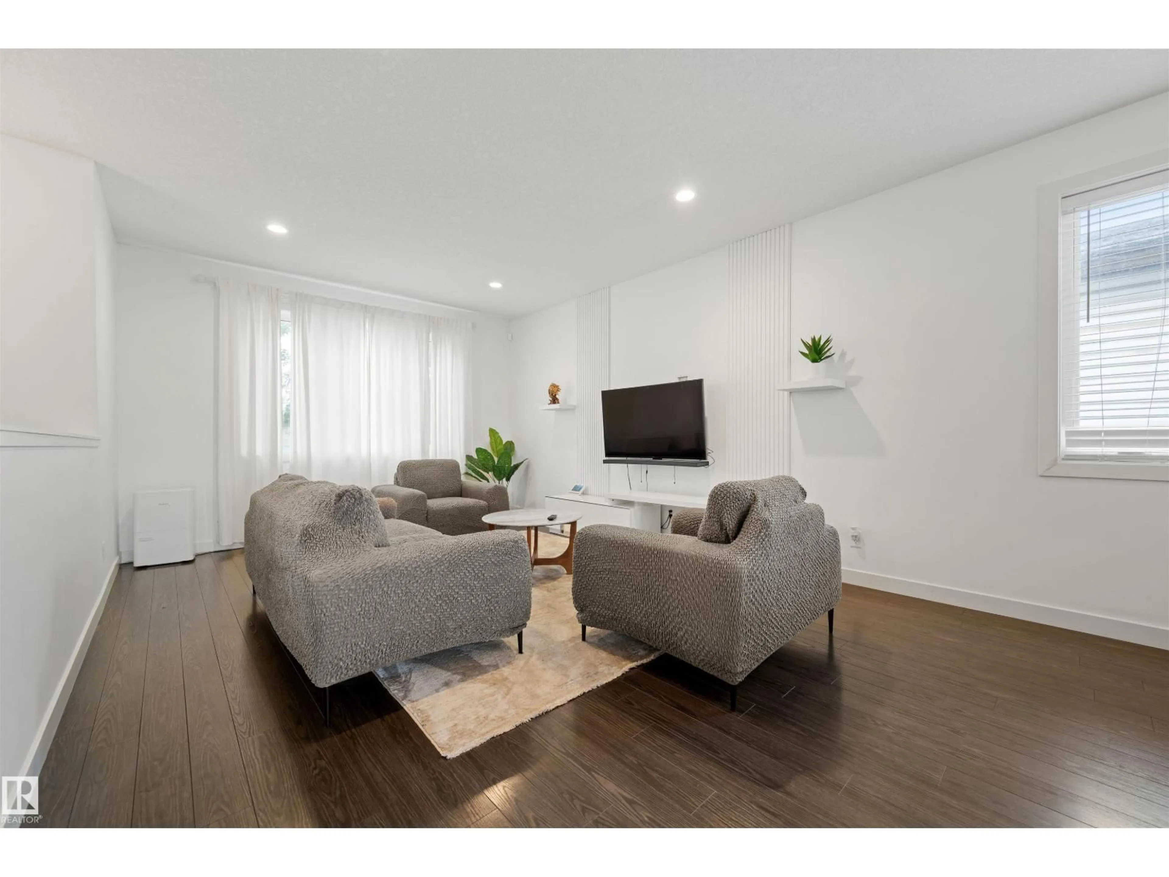 Living room with furniture, wood/laminate floor for 9645 150 ST, Edmonton Alberta T5P1N2