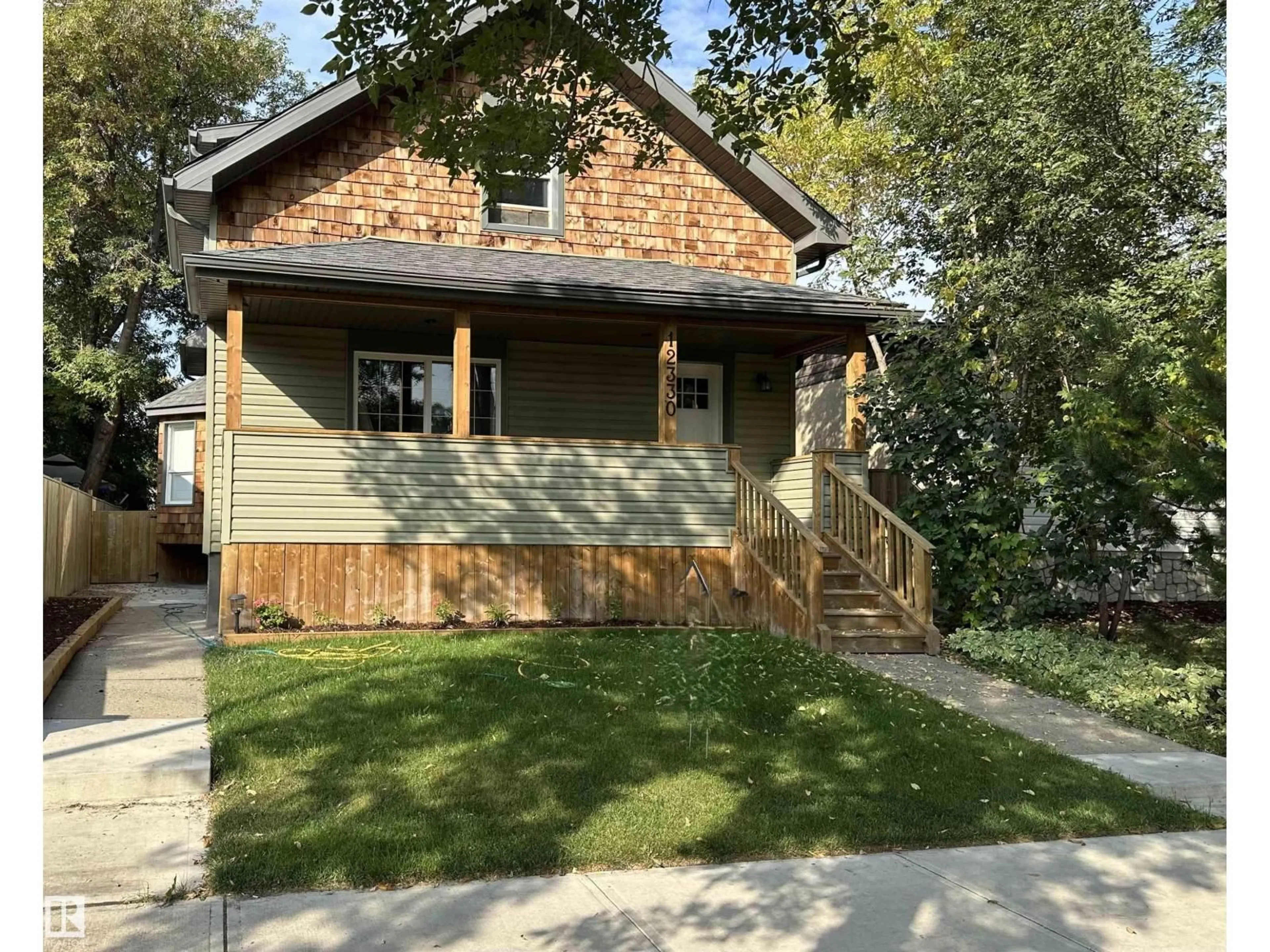Home with vinyl exterior material, street for NW - 12330 85 ST, Edmonton Alberta T5B3G9
