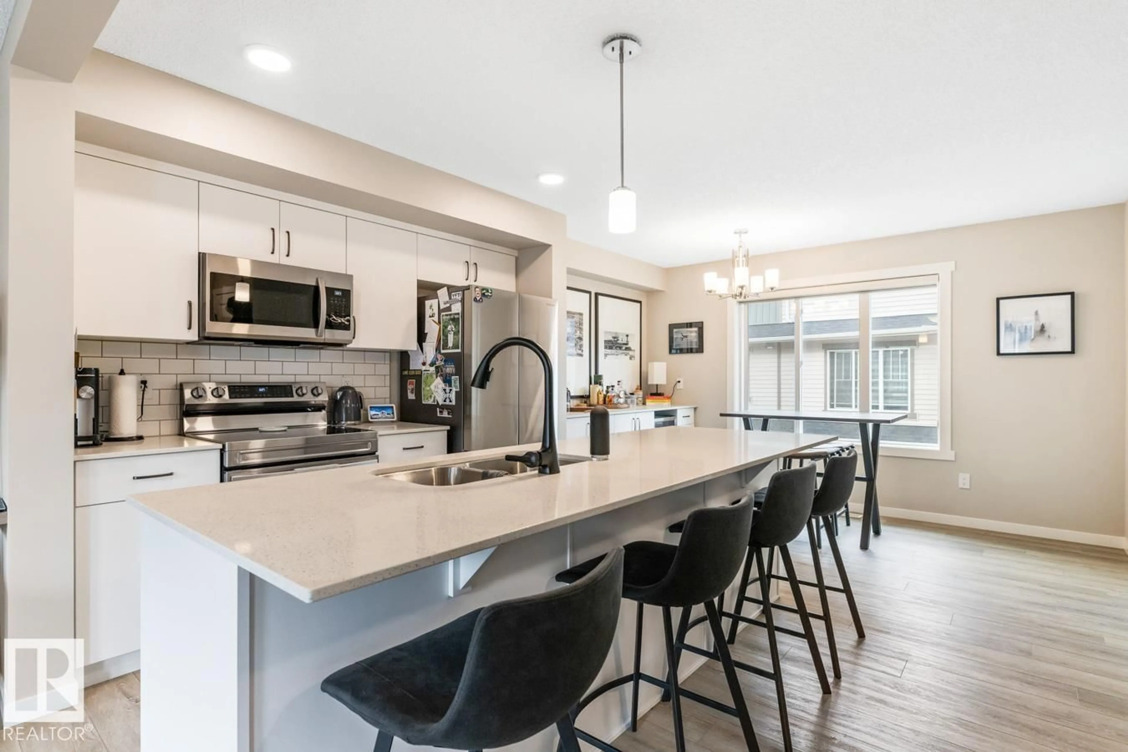 Open concept kitchen, ceramic/tile floor for 110 - 1530 TAMARACK BV, Edmonton Alberta T6T2E6