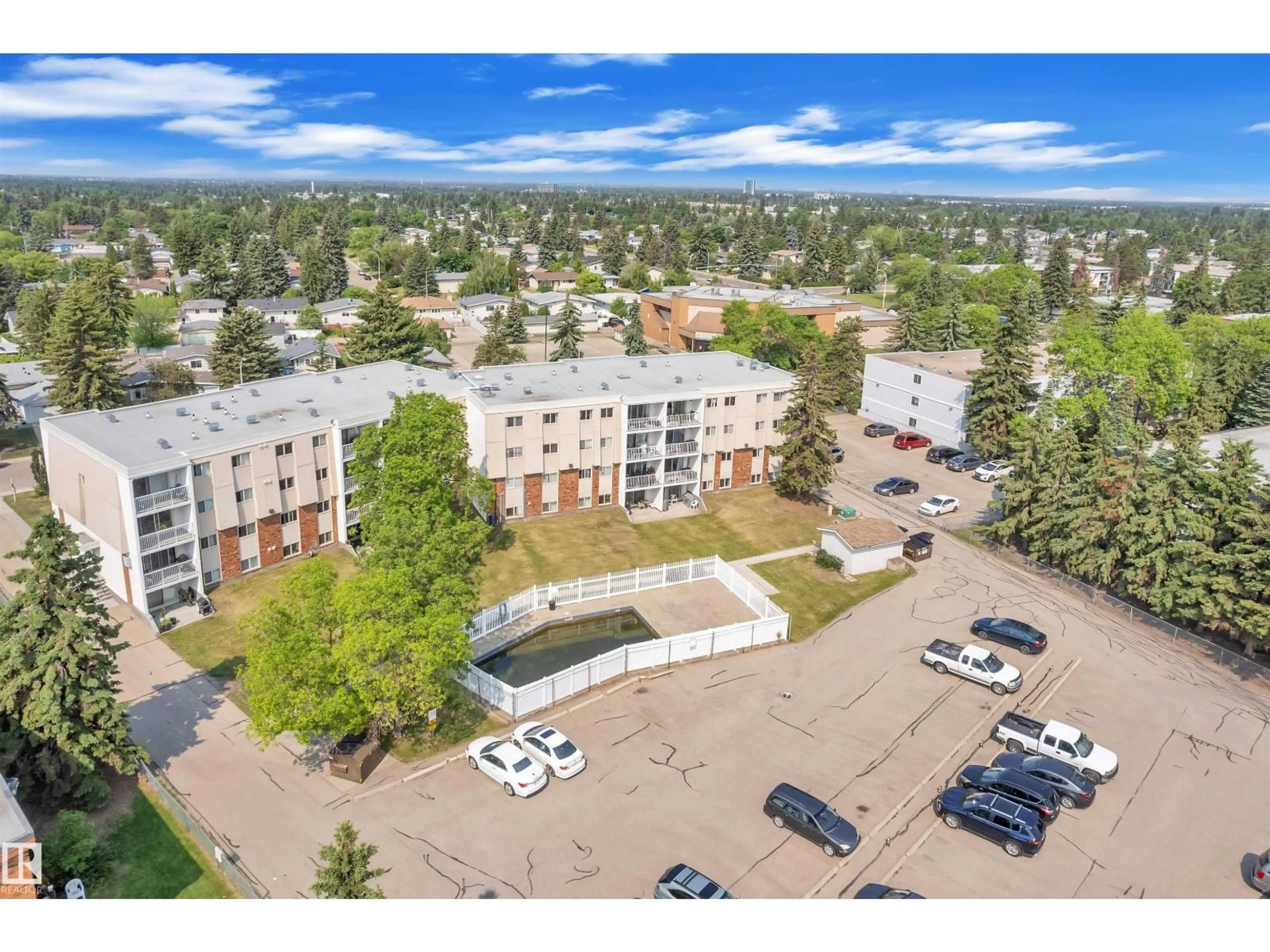 A pic from outside/outdoor area/front of a property/back of a property/a pic from drone, mountain view for #301 - 3835 107 ST, Edmonton Alberta T6J2N7