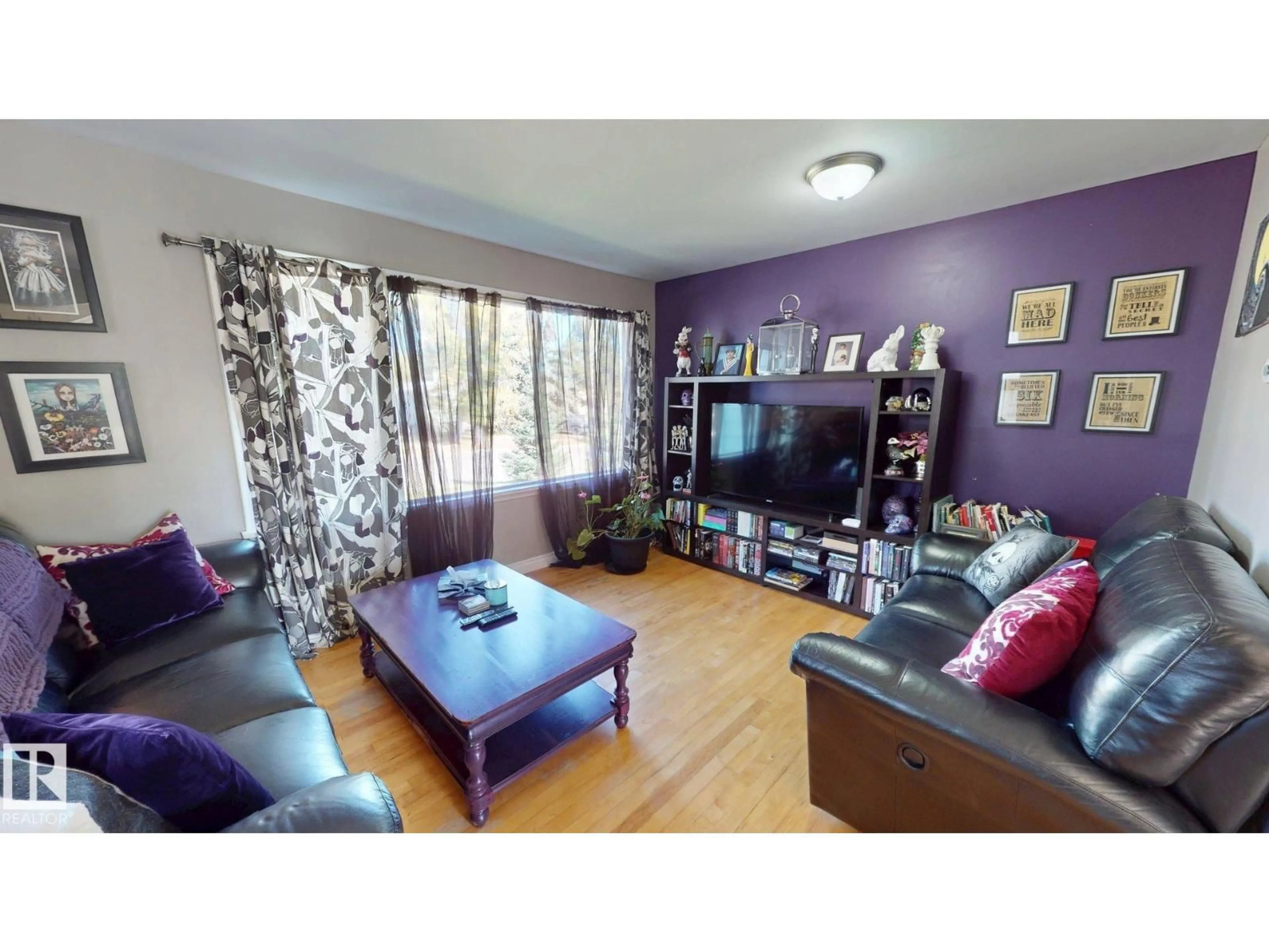 Living room with furniture, wood/laminate floor for 4729 47 AV, Drayton Valley Alberta T7A1H7