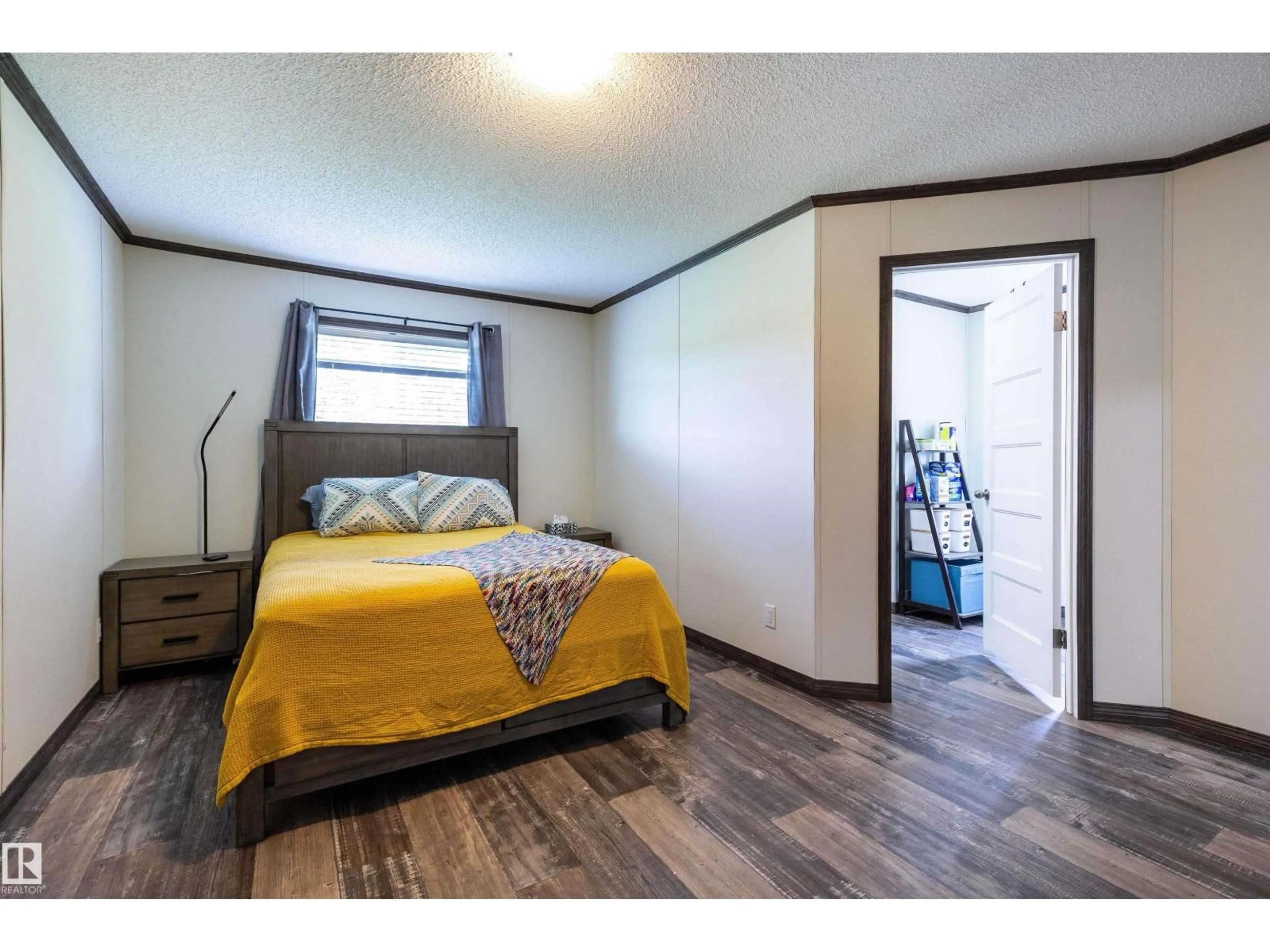 Bedroom with bed, wood/laminate floor for 55330 RGE ROAD 63, Rural Lac Ste. Anne County Alberta T0E2A0