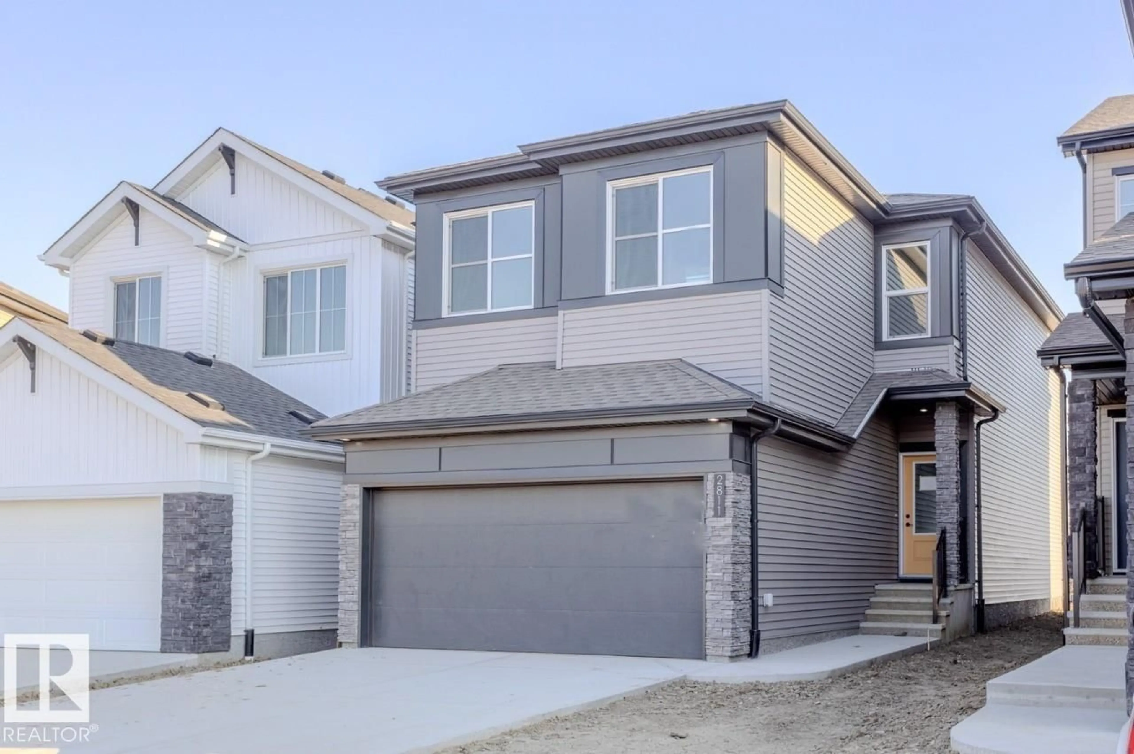 Home with vinyl exterior material, street for 2811 5 AV, Edmonton Alberta T6X1A7