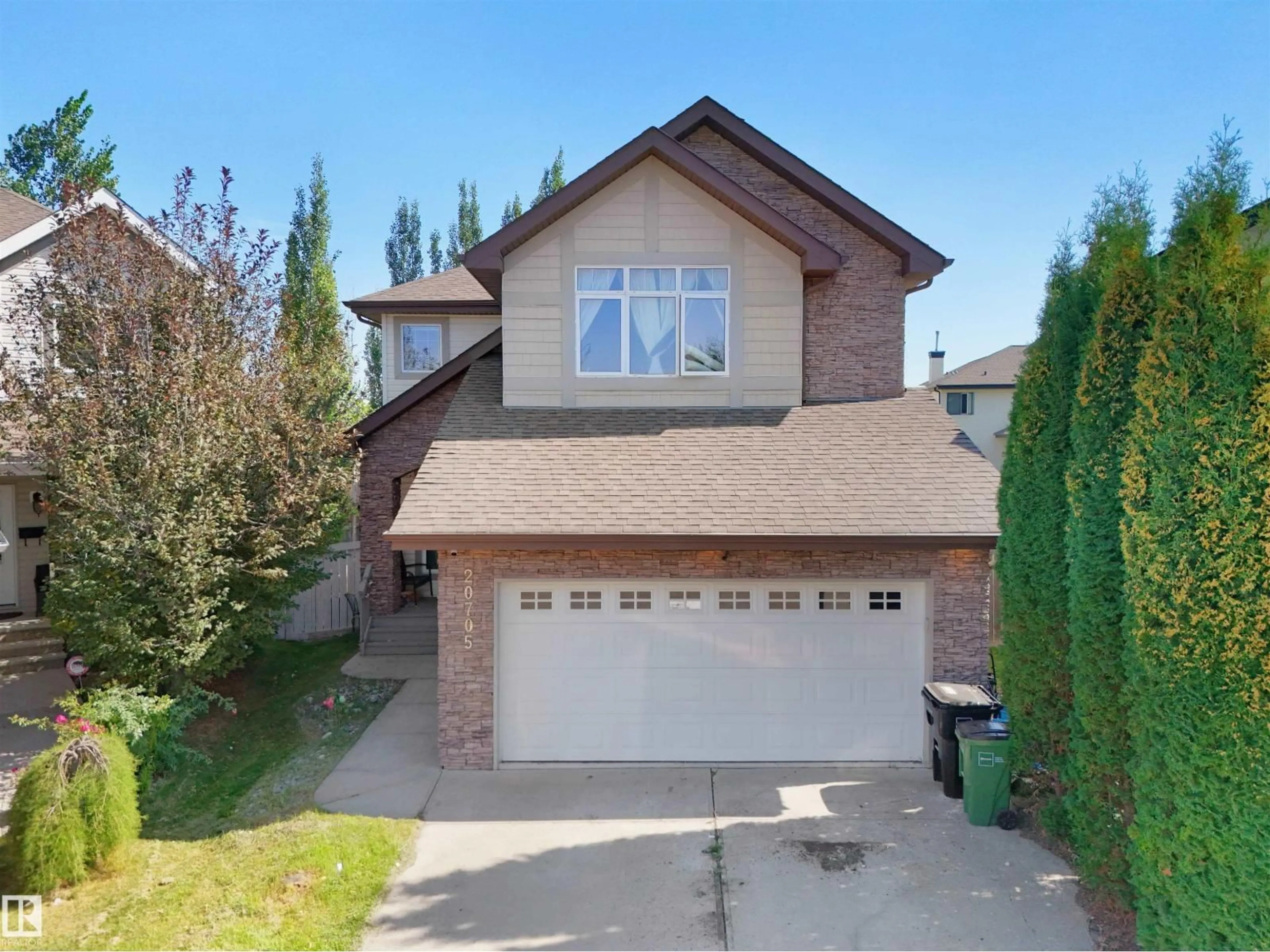 Home with vinyl exterior material, street for 20705 56A AV, Edmonton Alberta T6M0E7