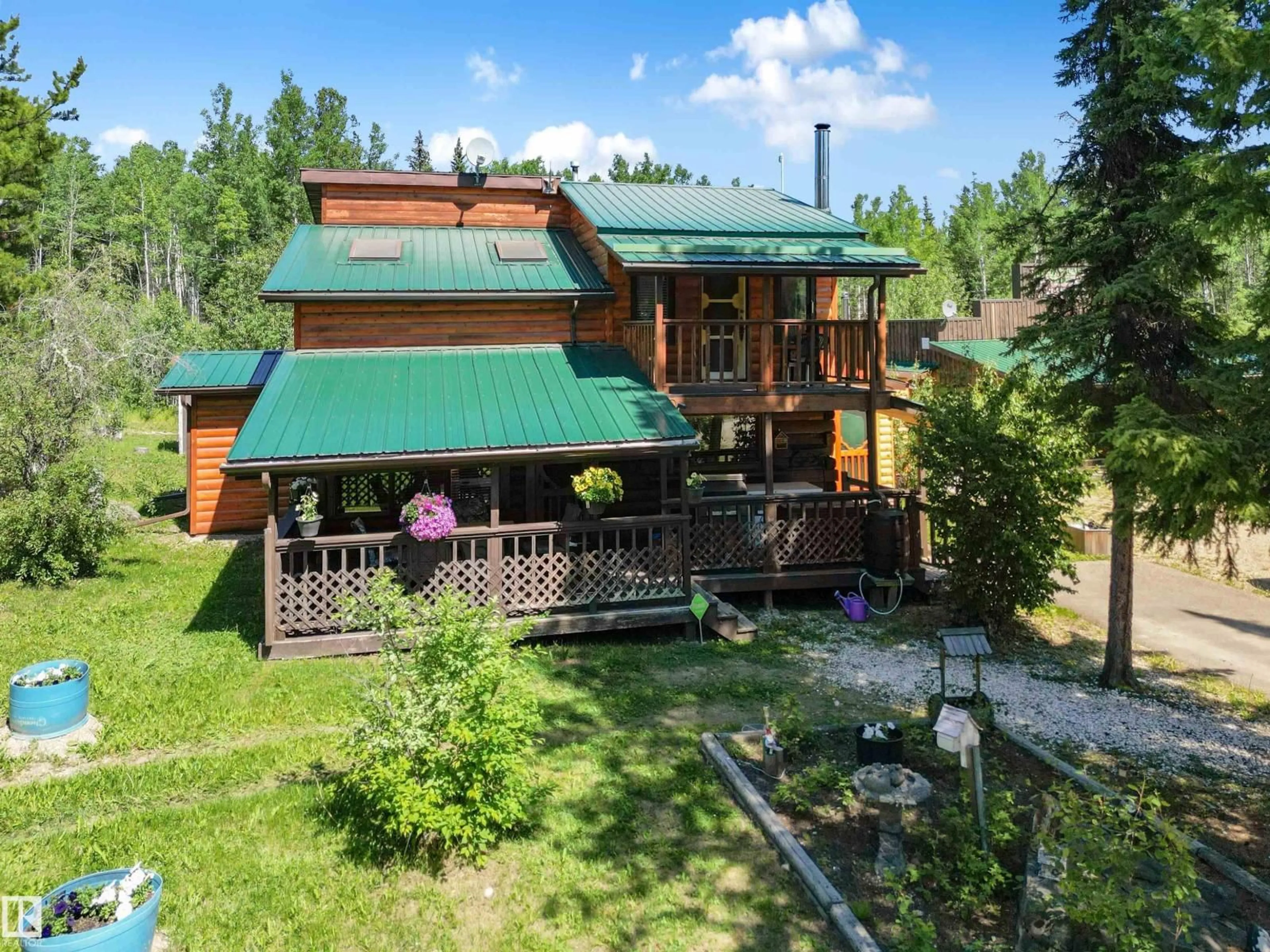A pic from outside/outdoor area/front of a property/back of a property/a pic from drone, mountain view for 4836 A 53 AVE & 4836 B 53 AV, Cynthia Alberta T0E0K0