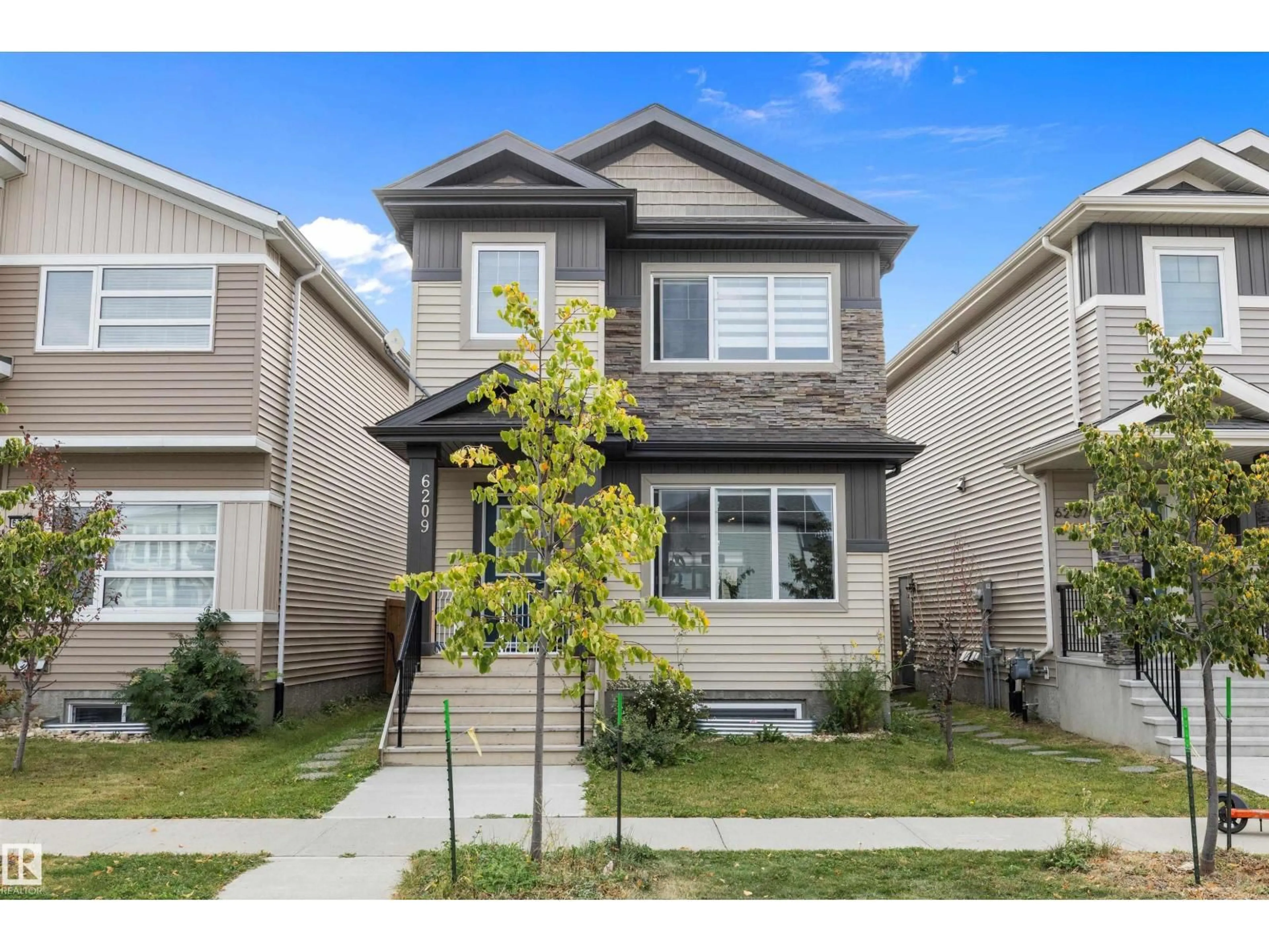 Home with vinyl exterior material, street for 6209 66 ST, Beaumont Alberta T4X2E3