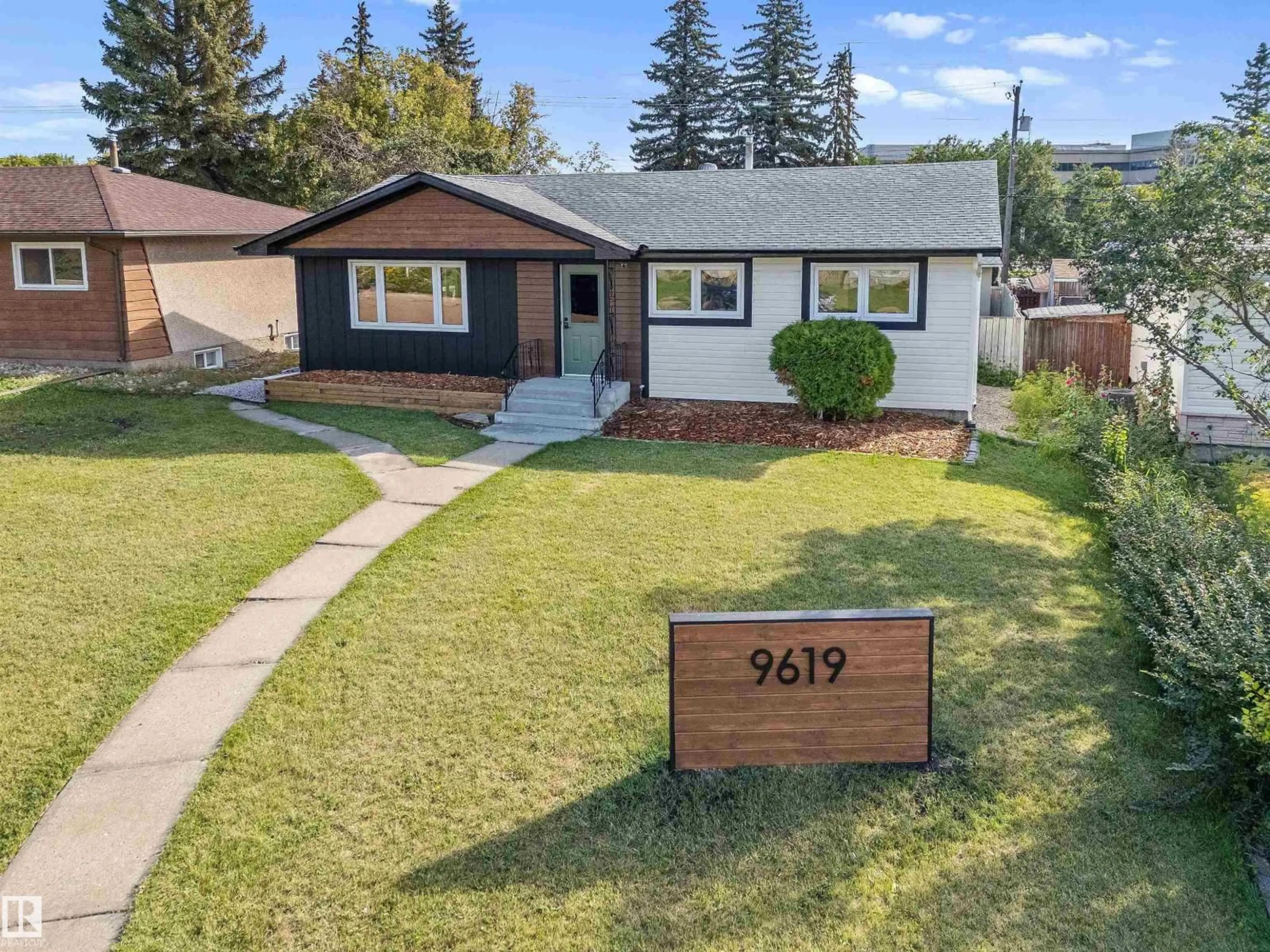 Home with vinyl exterior material, street for 9619 52 ST, Edmonton Alberta T6B1G8
