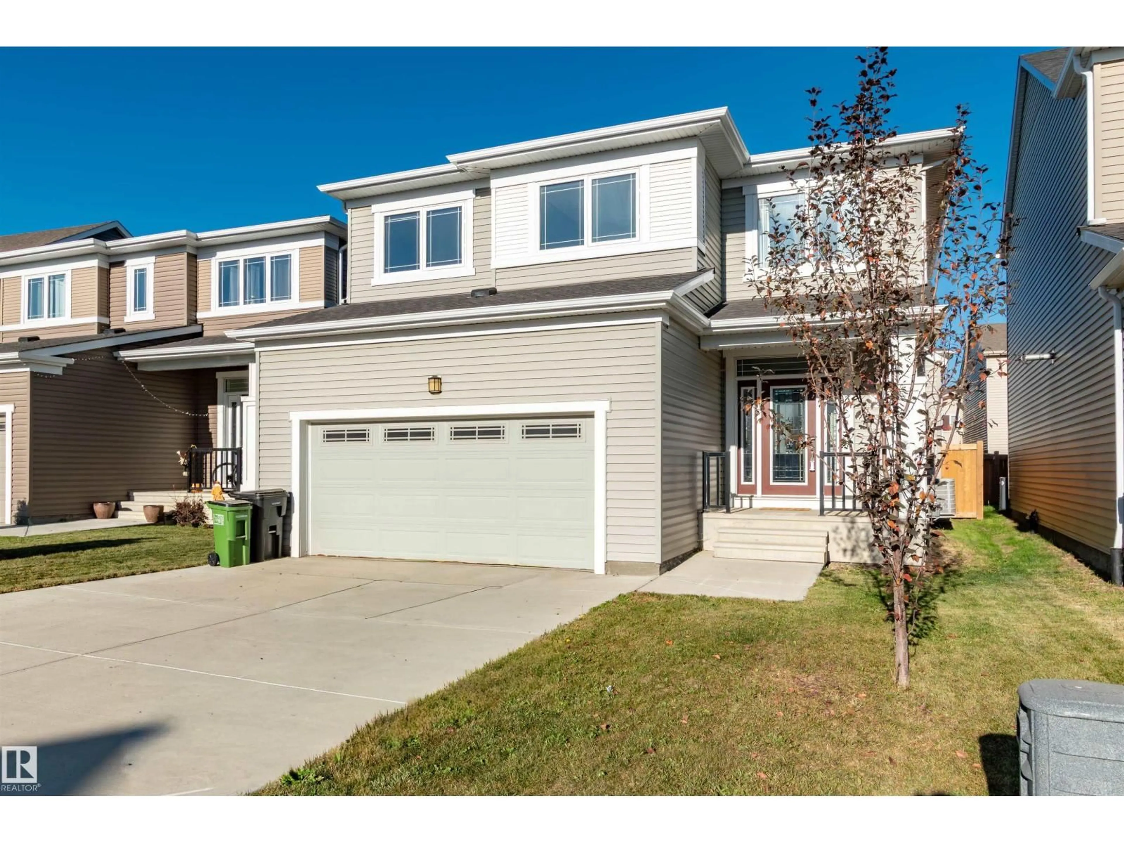 Home with vinyl exterior material, street for 1628 201 ST, Edmonton Alberta T6M0X6