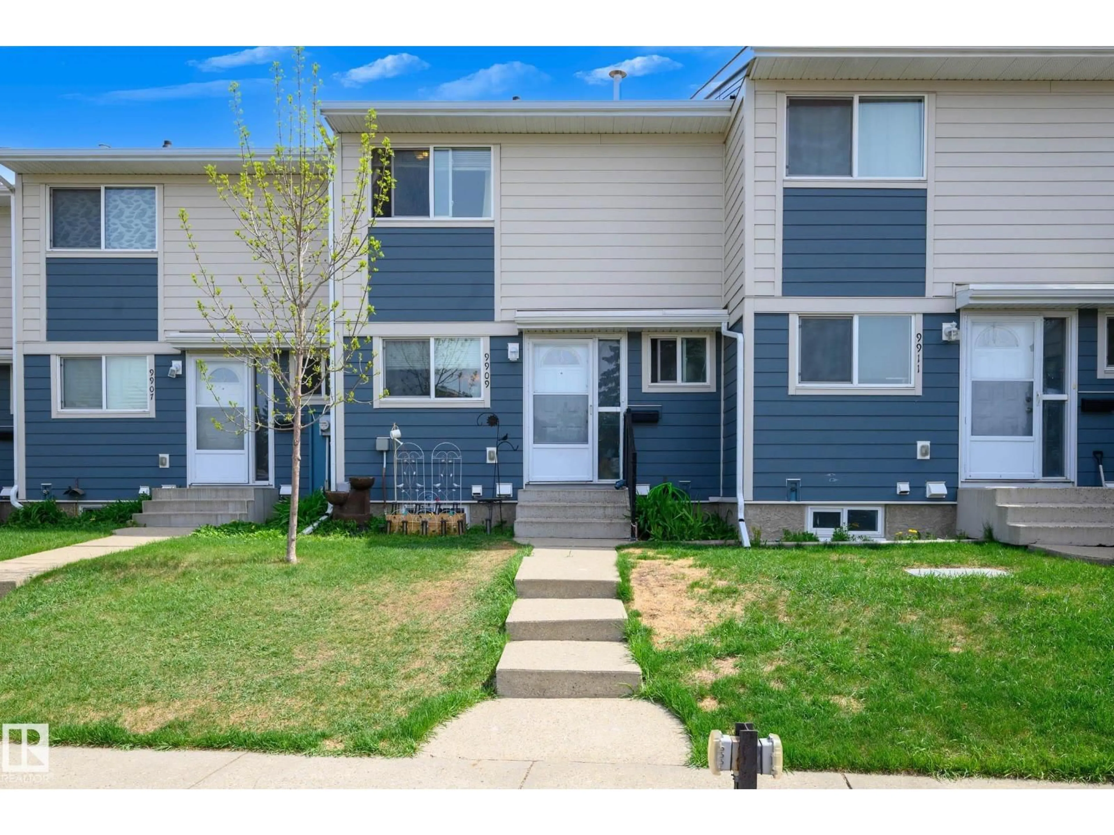 Home with vinyl exterior material, street for NW - 9909 171 AV, Edmonton Alberta T5X4X2