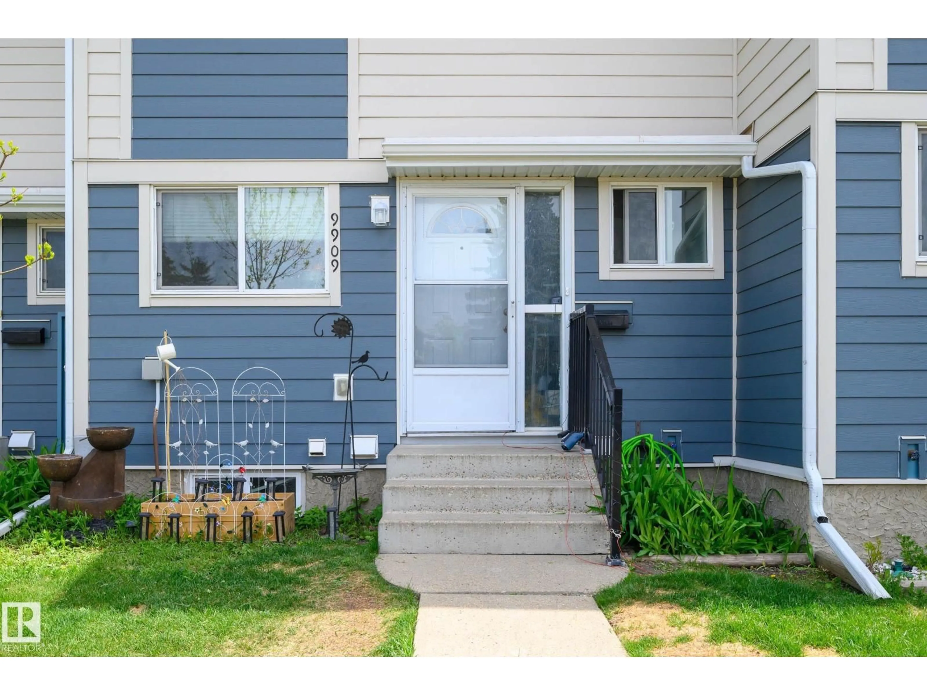 Home with vinyl exterior material, street for NW - 9909 171 AV, Edmonton Alberta T5X4X2
