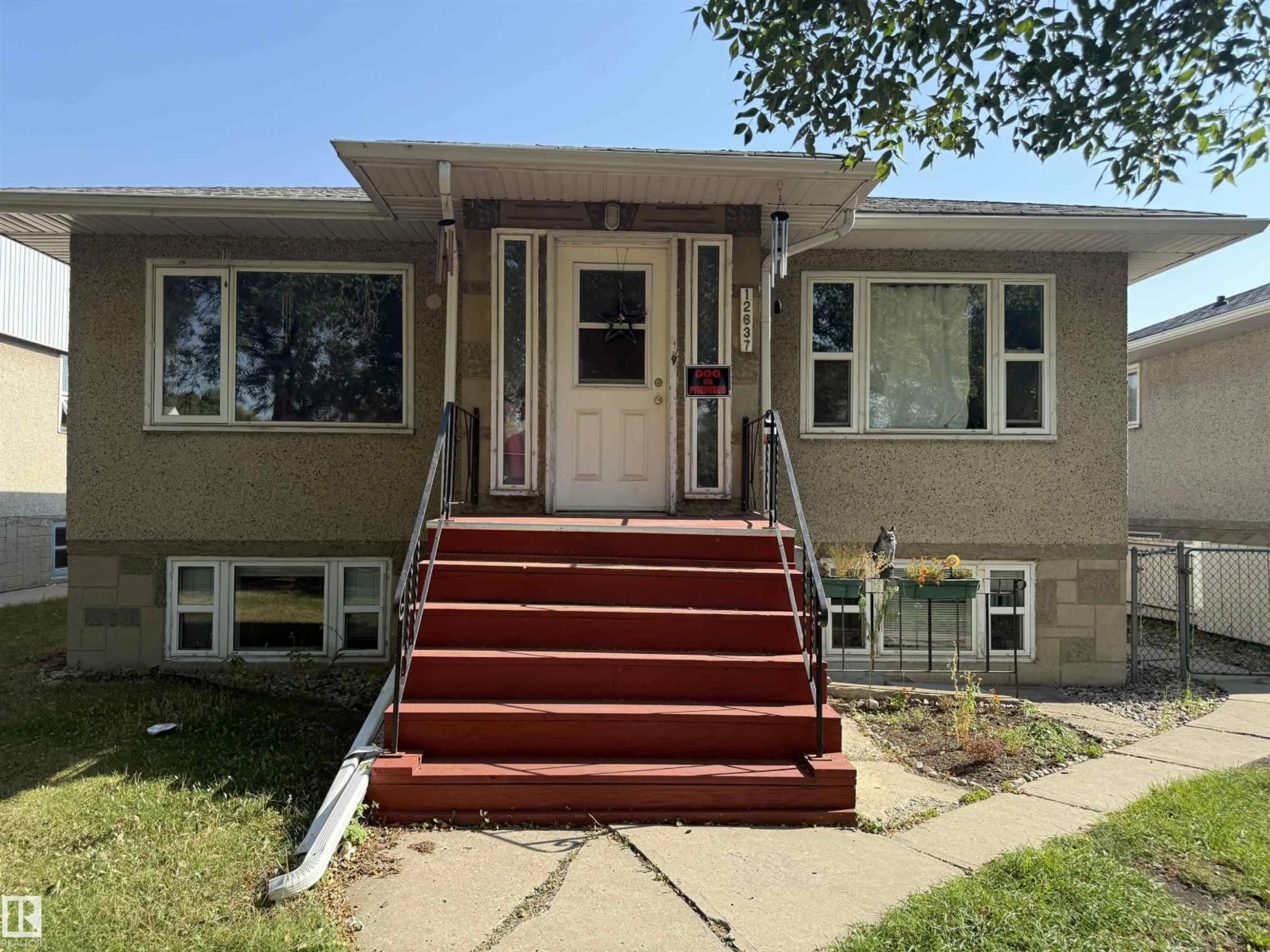 Home with vinyl exterior material, street for 12637 70 ST, Edmonton Alberta T6L3R6