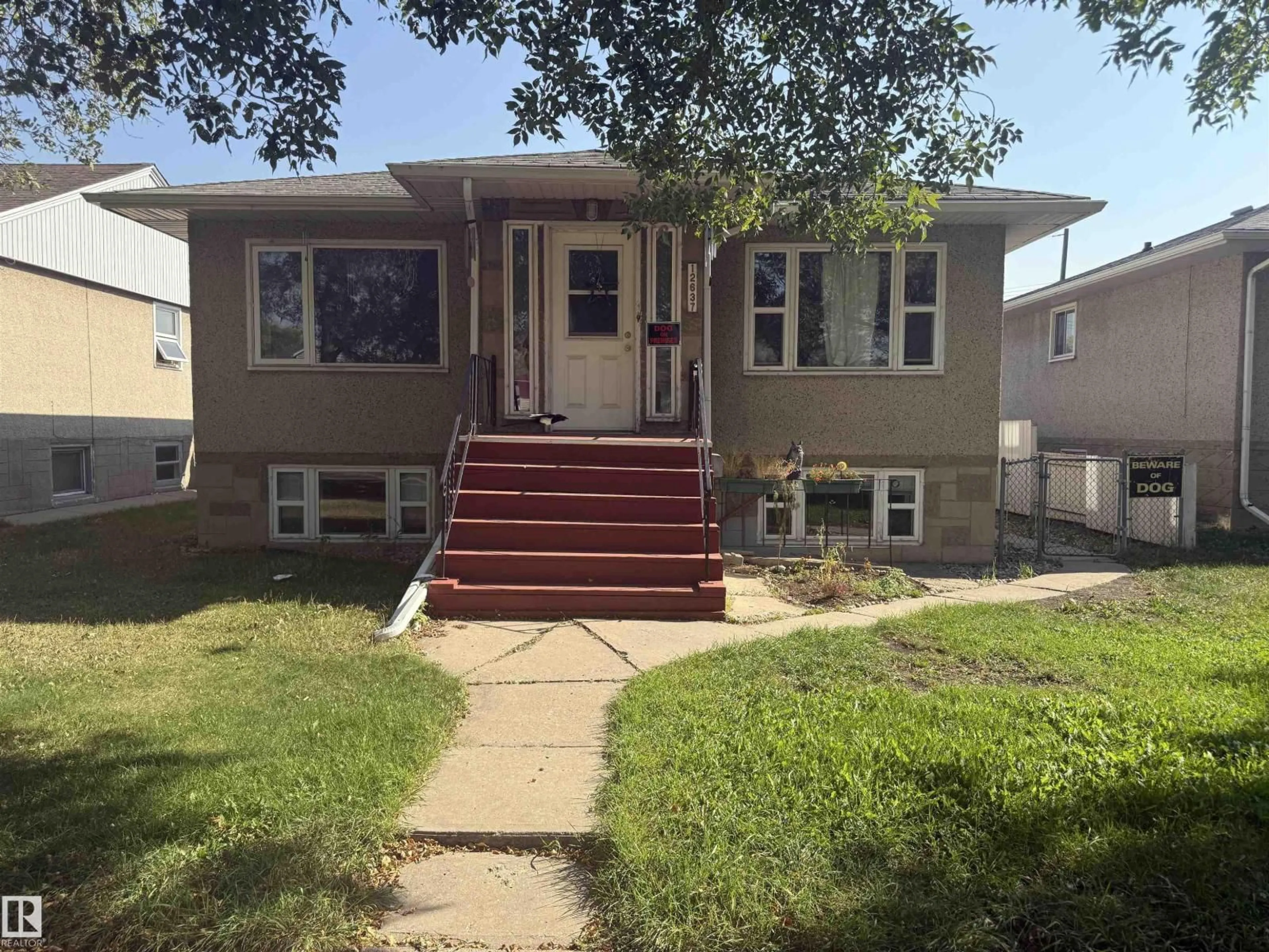 Home with vinyl exterior material, street for 12637 70 ST, Edmonton Alberta T6L3R6