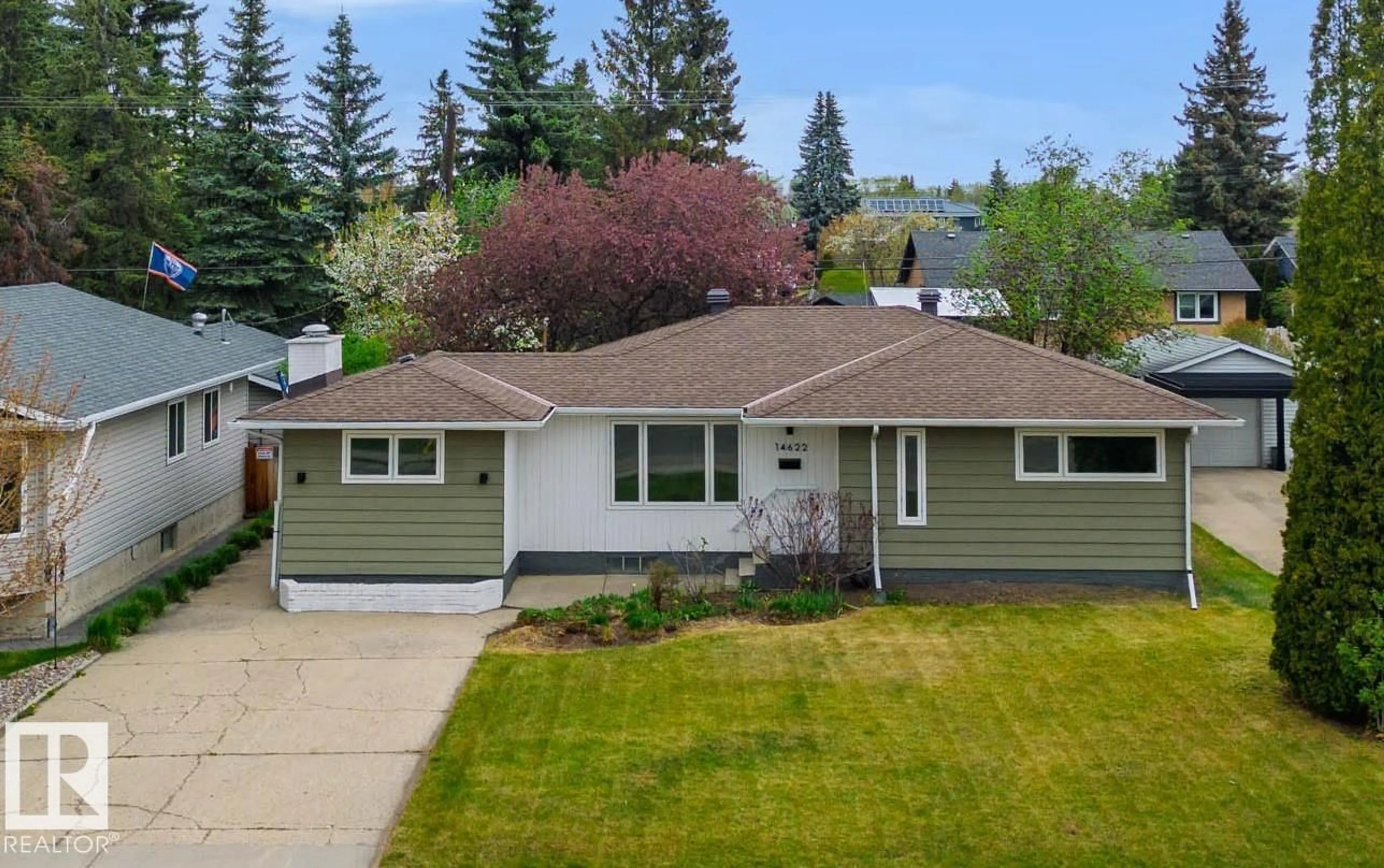 Home with vinyl exterior material, street for 14622 95 AV, Edmonton Alberta T5N0B3