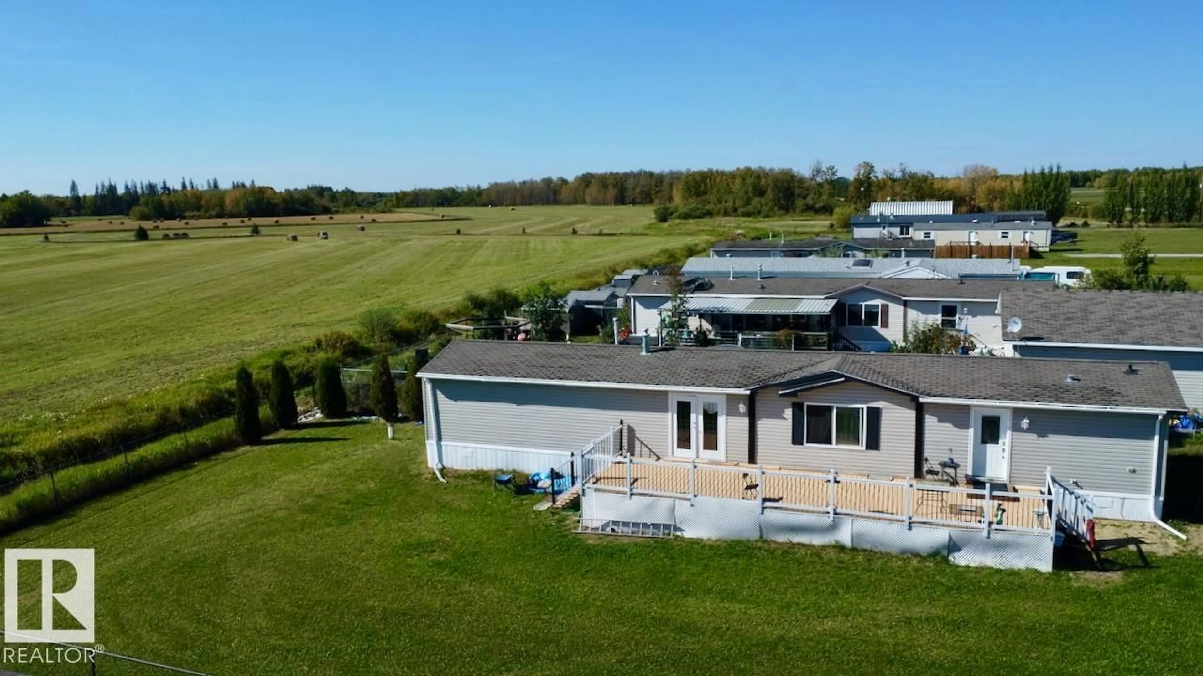 A pic from outside/outdoor area/front of a property/back of a property/a pic from drone, water/lake/river/ocean view for 153 - 3510 STE. ANNE TR, Rural Lac Ste. Anne County Alberta T0E0A0