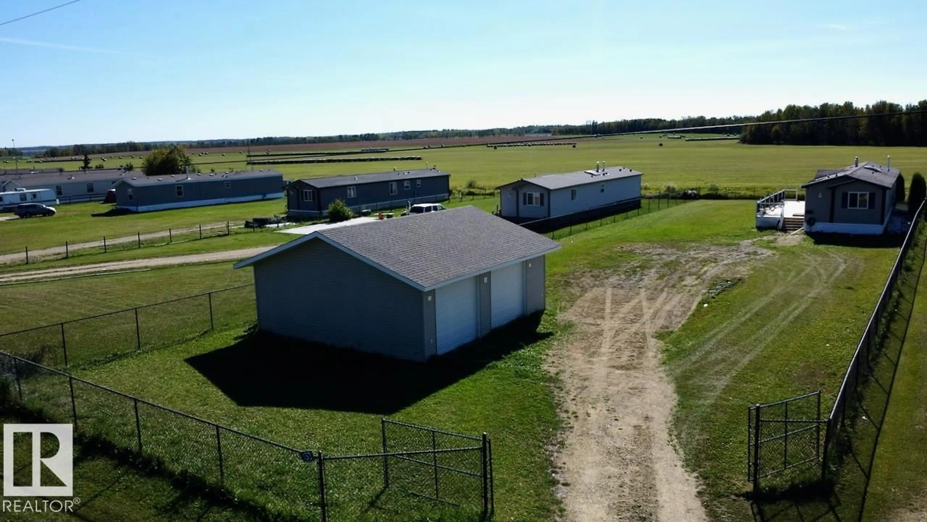 A pic from outside/outdoor area/front of a property/back of a property/a pic from drone, building for 153 - 3510 STE. ANNE TR, Rural Lac Ste. Anne County Alberta T0E0A0