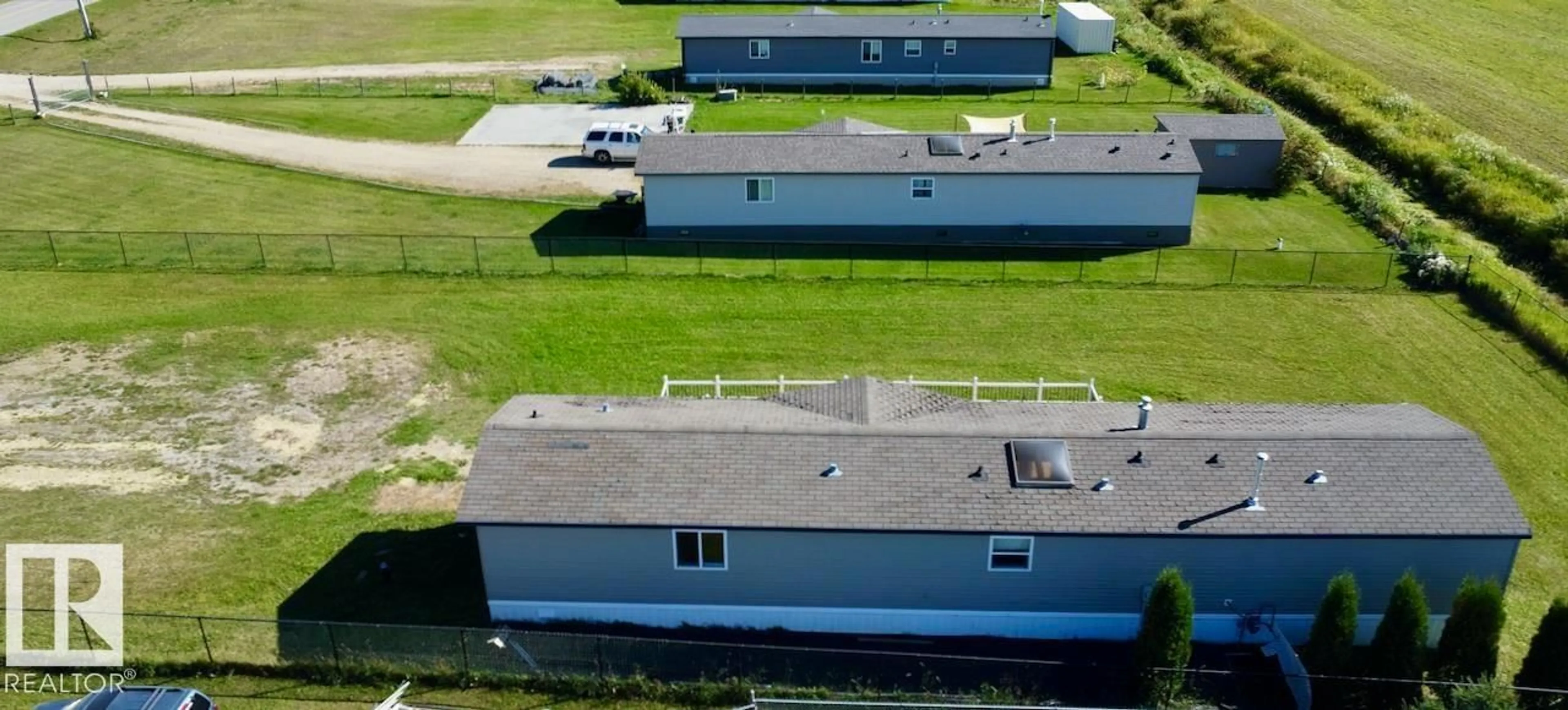 A pic from outside/outdoor area/front of a property/back of a property/a pic from drone, building for 153 - 3510 STE. ANNE TR, Rural Lac Ste. Anne County Alberta T0E0A0