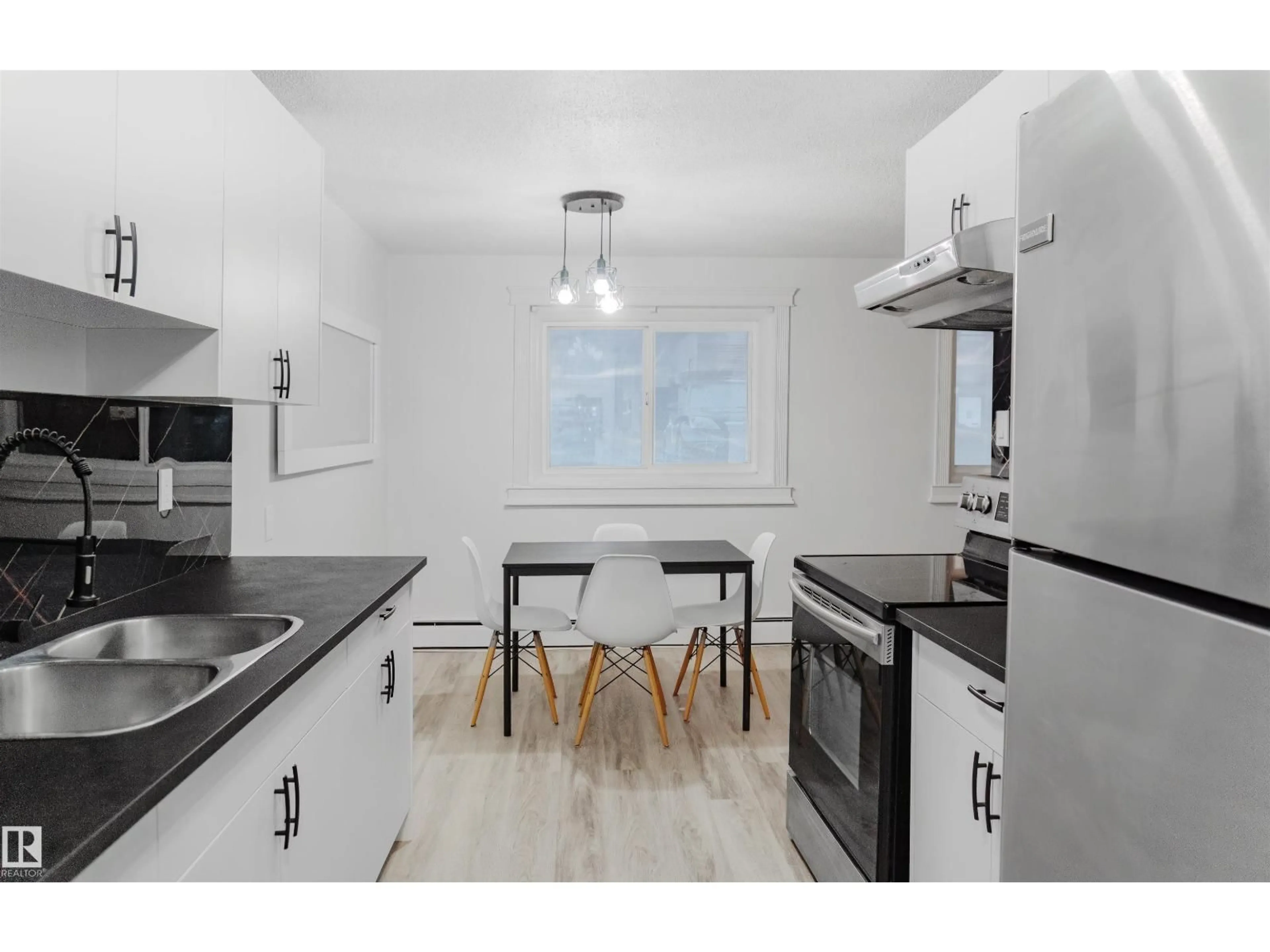 Standard kitchen, wood/laminate floor for 107 - 7204 81 AV NW, Edmonton Alberta T6B0E2
