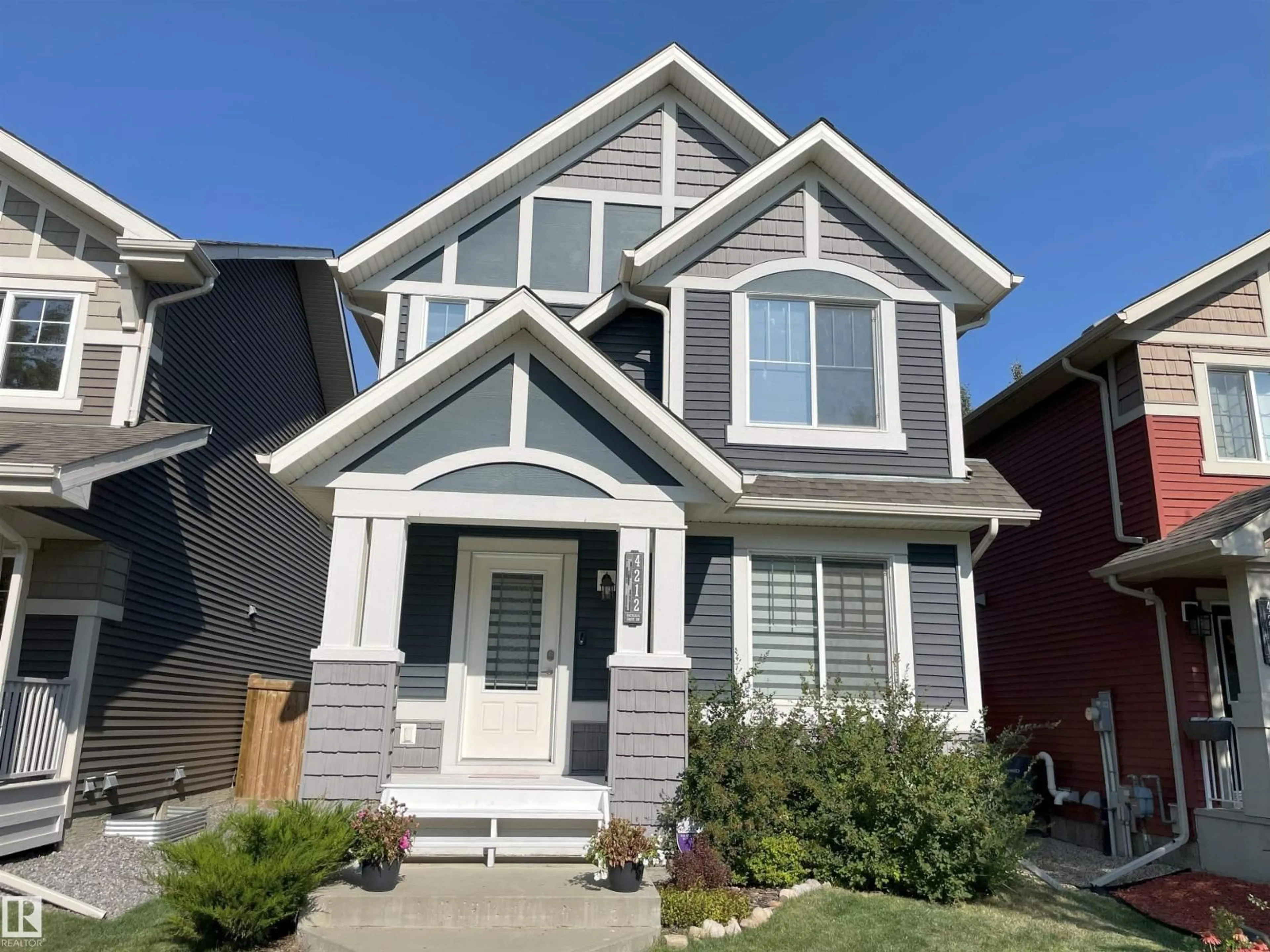 Home with vinyl exterior material, street for 4212 ORCHARDS DR, Edmonton Alberta T6X1N9