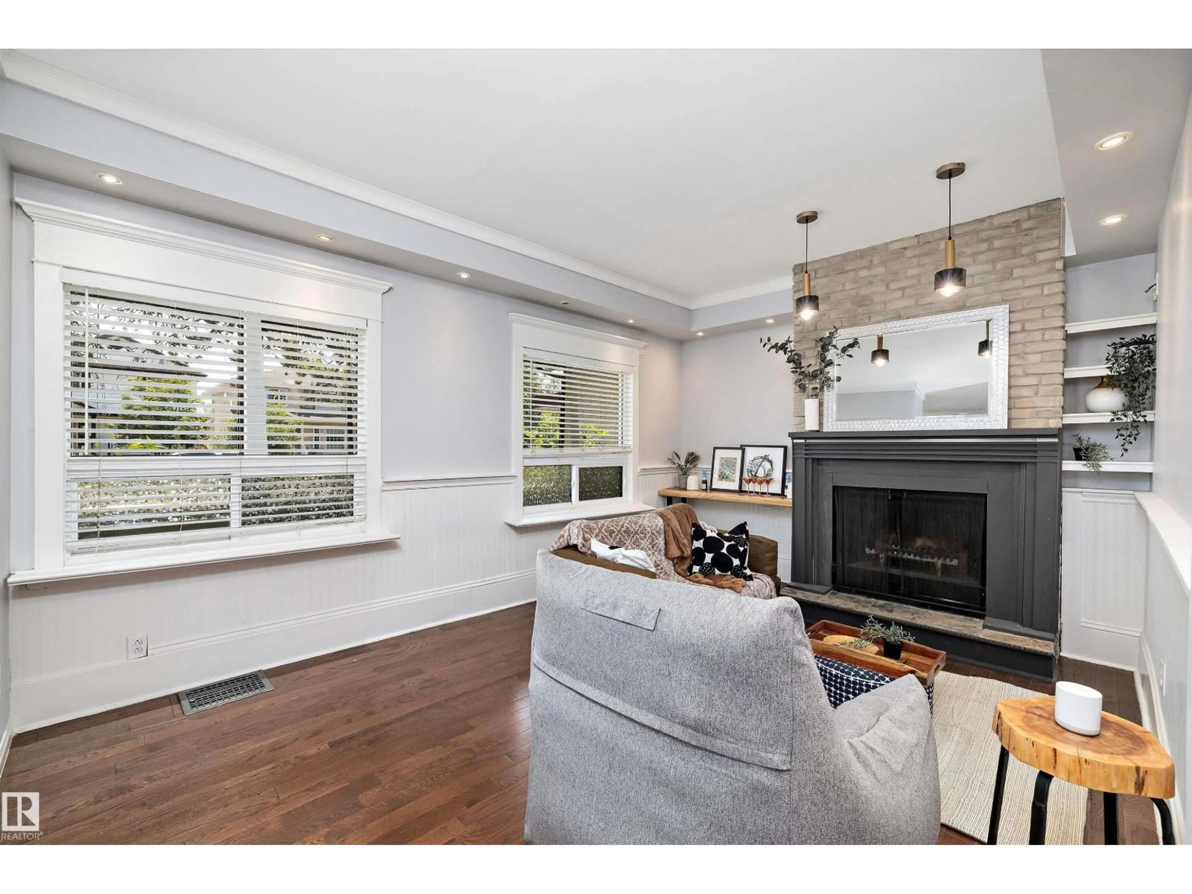 Living room with furniture, wood/laminate floor for 8702 92A AV, Edmonton Alberta T6C1S6