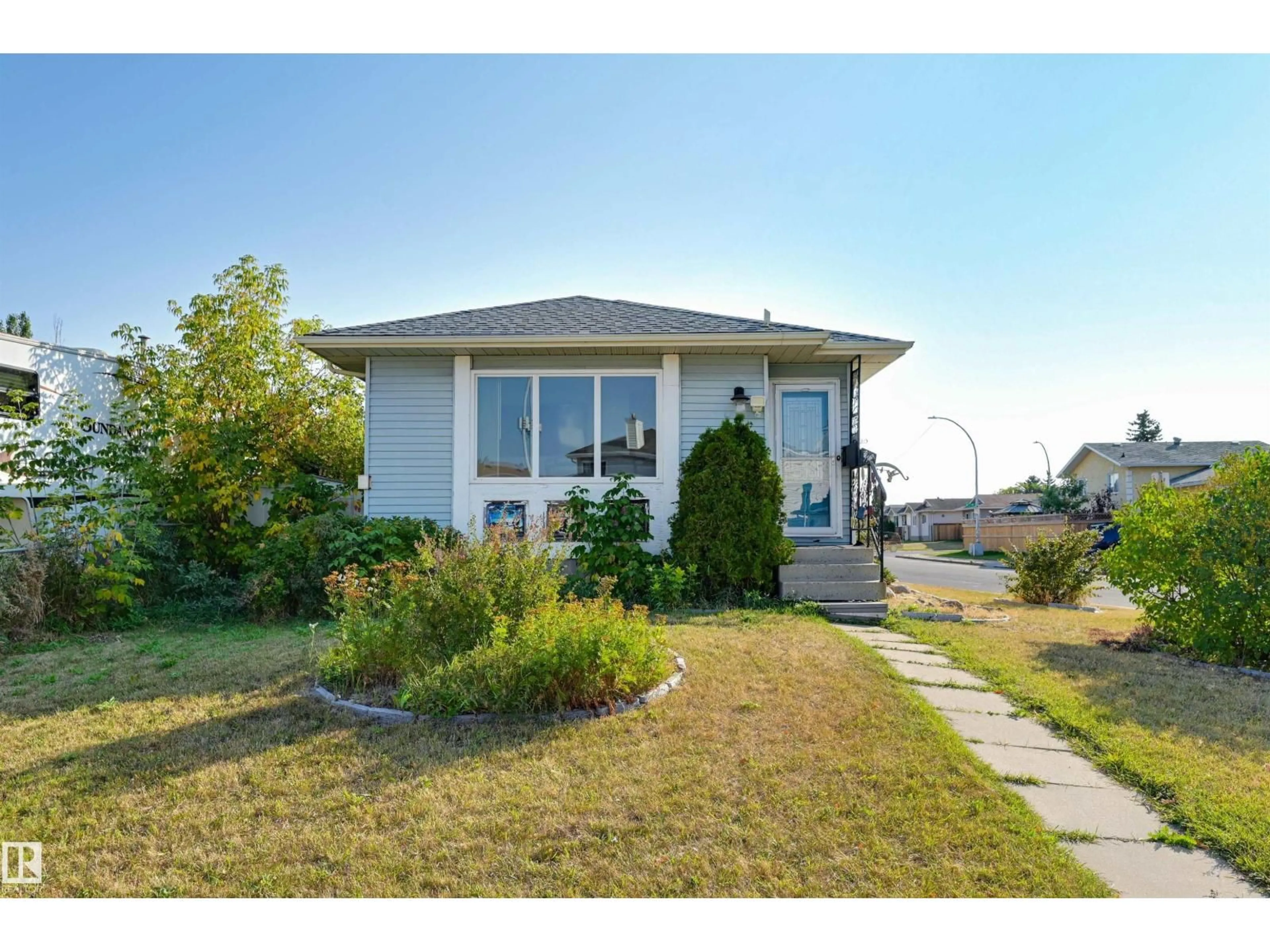 Home with vinyl exterior material, street for 14703 35 ST, Edmonton Alberta T5Y2H8